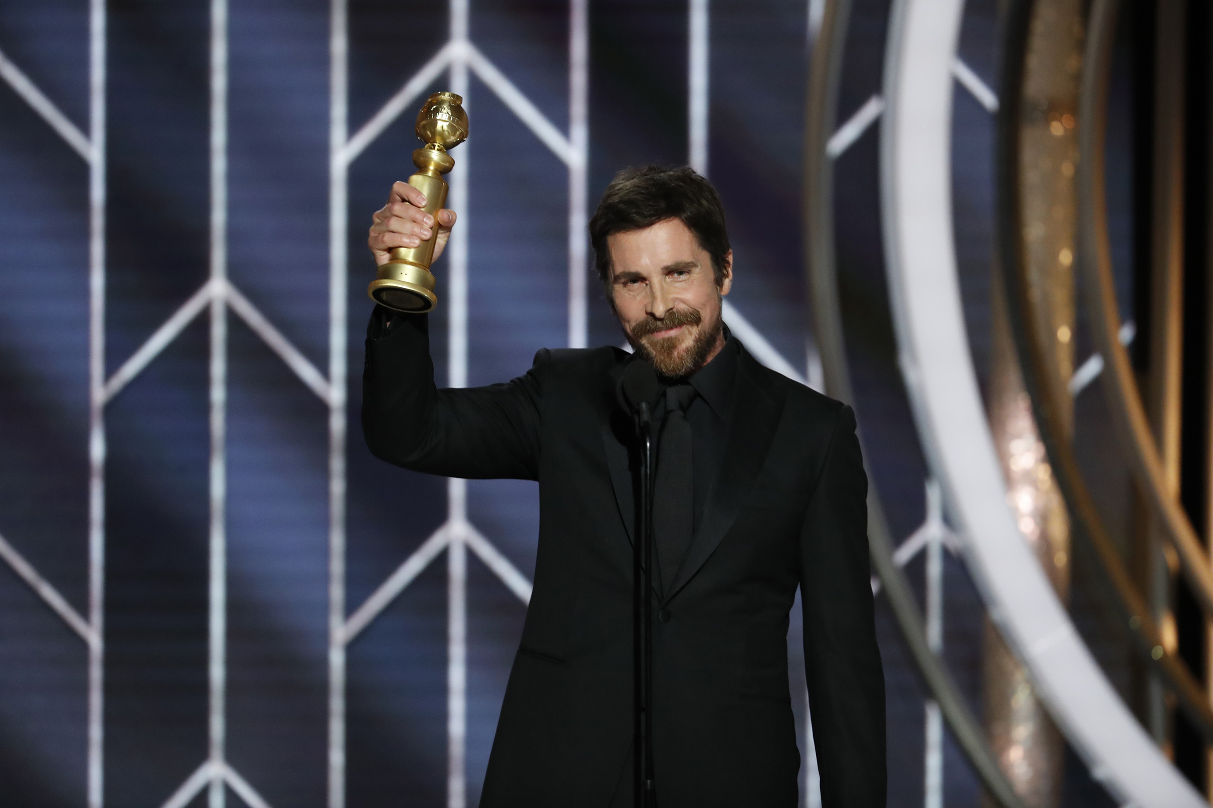 Christian Bale from “Vice” accepts the Best Actor in a Motion Picture – Musical or Comedy award onstage during the 76th Annual Golden Globe Awards. (NBCUniversal/Getty Images)