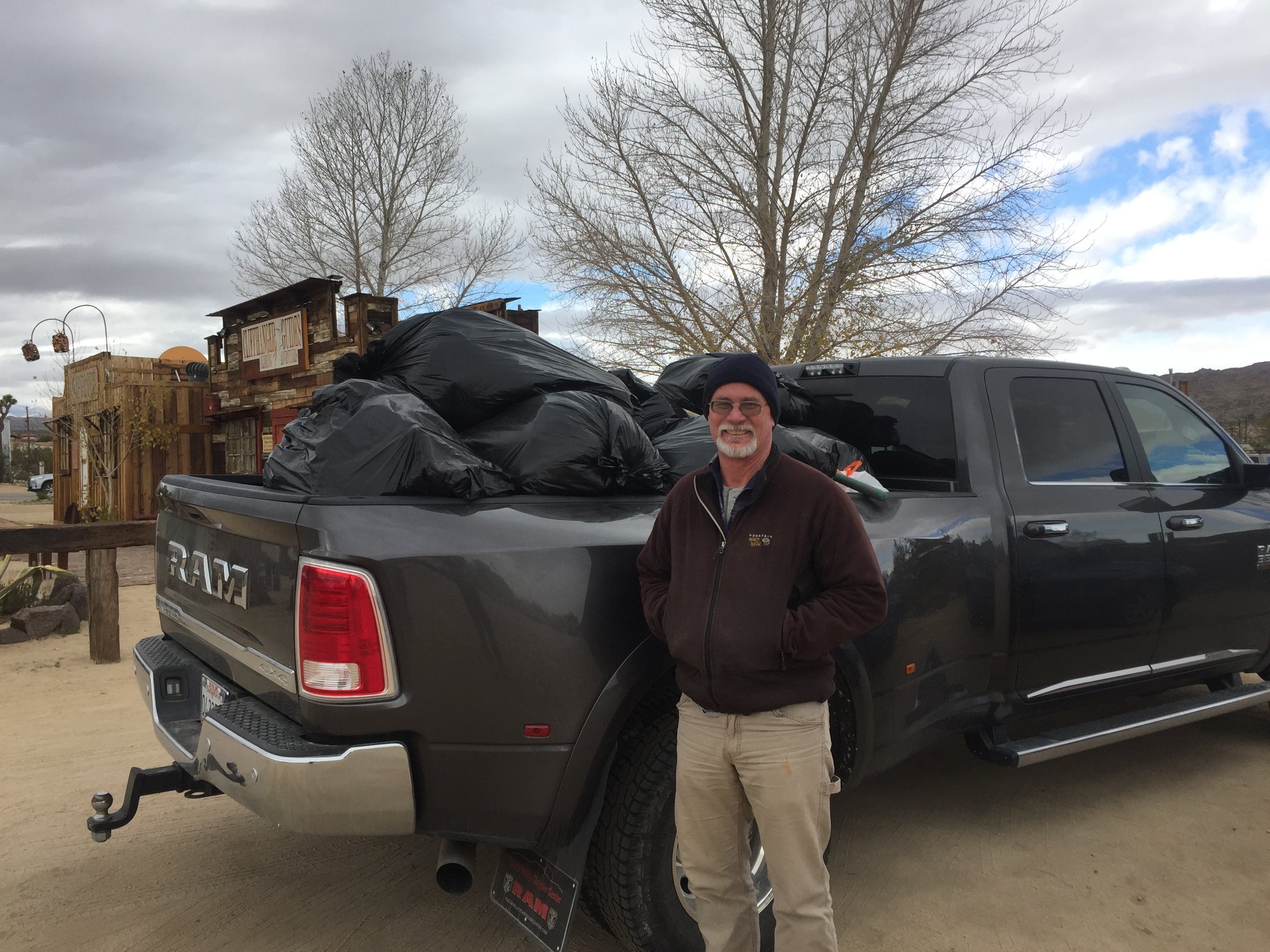 Seth Zaharias, co-owner of Cliffhanger Guides, helps haul  trash out of Joshua Tree National Park on Jan. 1, 2019. (Photo Courtesy of Facebook)