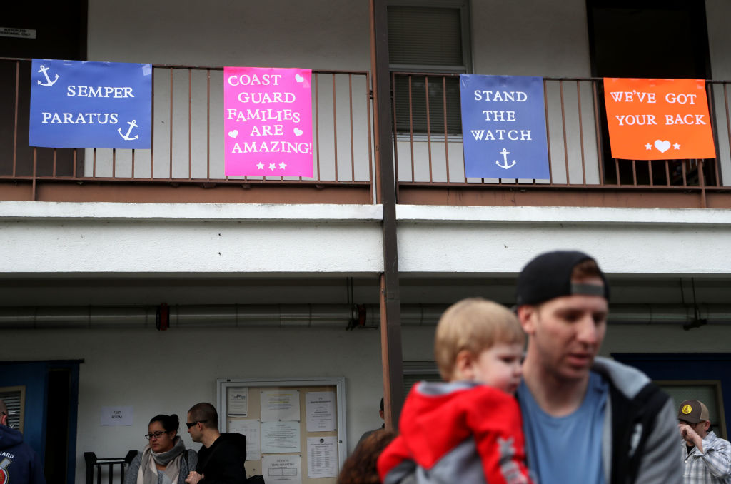 NOVATO, CALIFORNIA - JANUARY 19: Signs are posted during an event for U.S. Coast Guard families to receive free groceries on January 19, 2019 in Novato, California. As the partial government shutdown enters its fourth week, an estimated 150 U.S. Coast Guard families in the San Francisco Bay Area, who are currently not being paid, received free groceries during an event organized by the San Francisco-Marin Food Bank and the North Bay Coast Guard Spouses Club. (Photo by Justin Sullivan/Getty Images) (Signs are posted during an event for U.S. Coast Guard families to receive free groceries on January 19, 2019 in Novato, California)