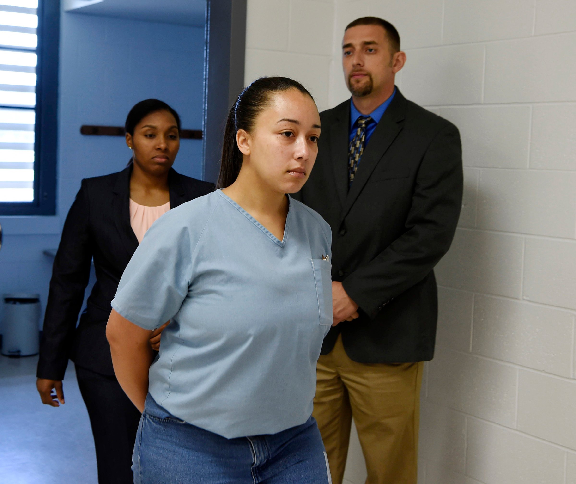 Cyntoia Brown, a woman serving a life sentence for killing a man when she was a 16-year-old prostitute, enters her clemency hearing Wednesday, May 23, 2018, at Tennessee Prison for Women in Nashville, Tenn.