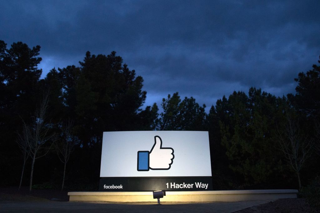 A lit sign is seen at the entrance to Facebook's corporate headquarters location in Menlo Park, Ca. on March 21, 2018. Facebook said on Jan. 31, 2019 that it has removed 783 fake accounts linked to Iran. (Josh Edelson—AFP/Getty Images)