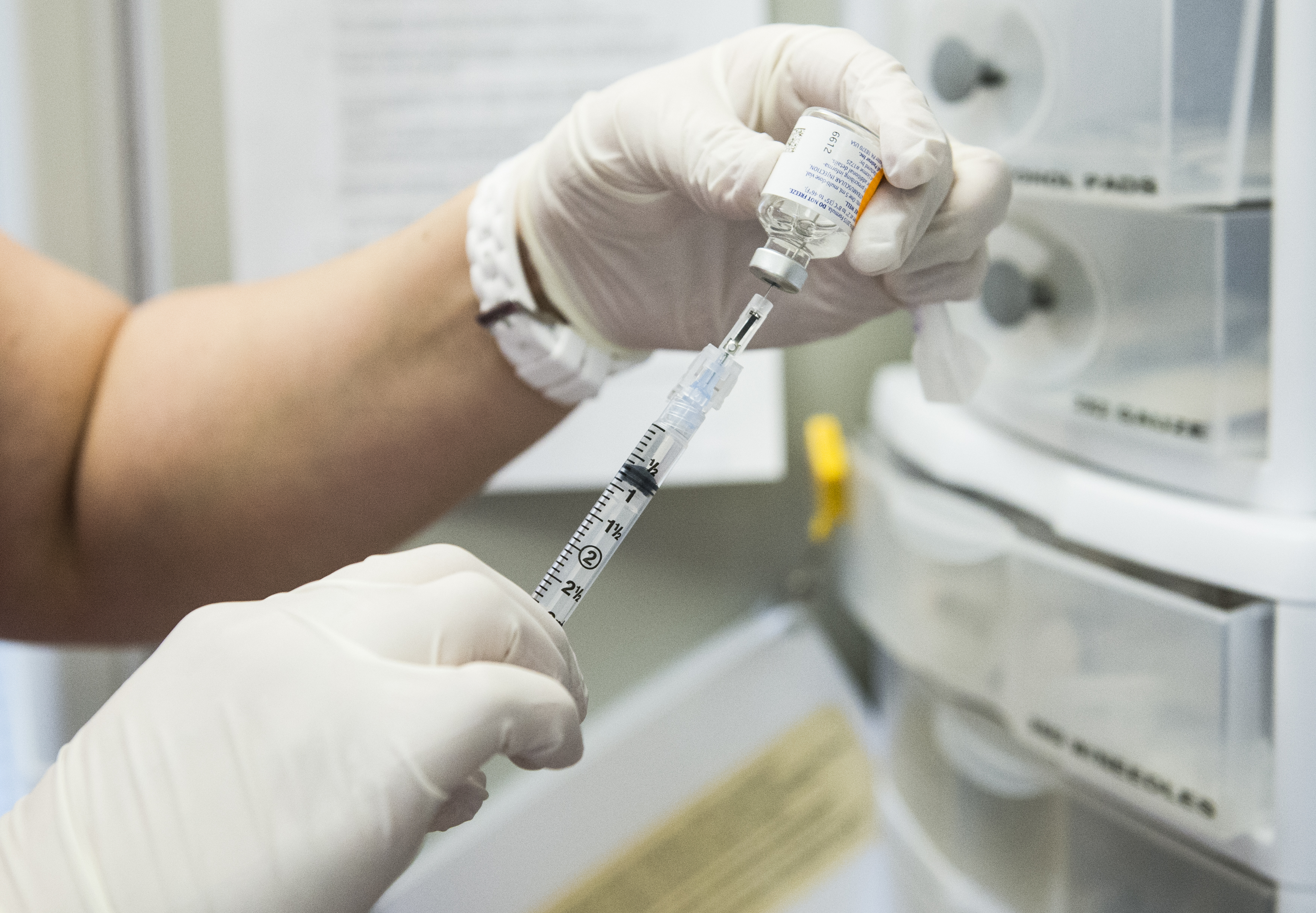 The flu vaccine is drawn from the vile into the needle at Crawford Kids Clinic in Aurora, Colorado. (Brent Lewis&amp; Denver Post via Getty Images)
