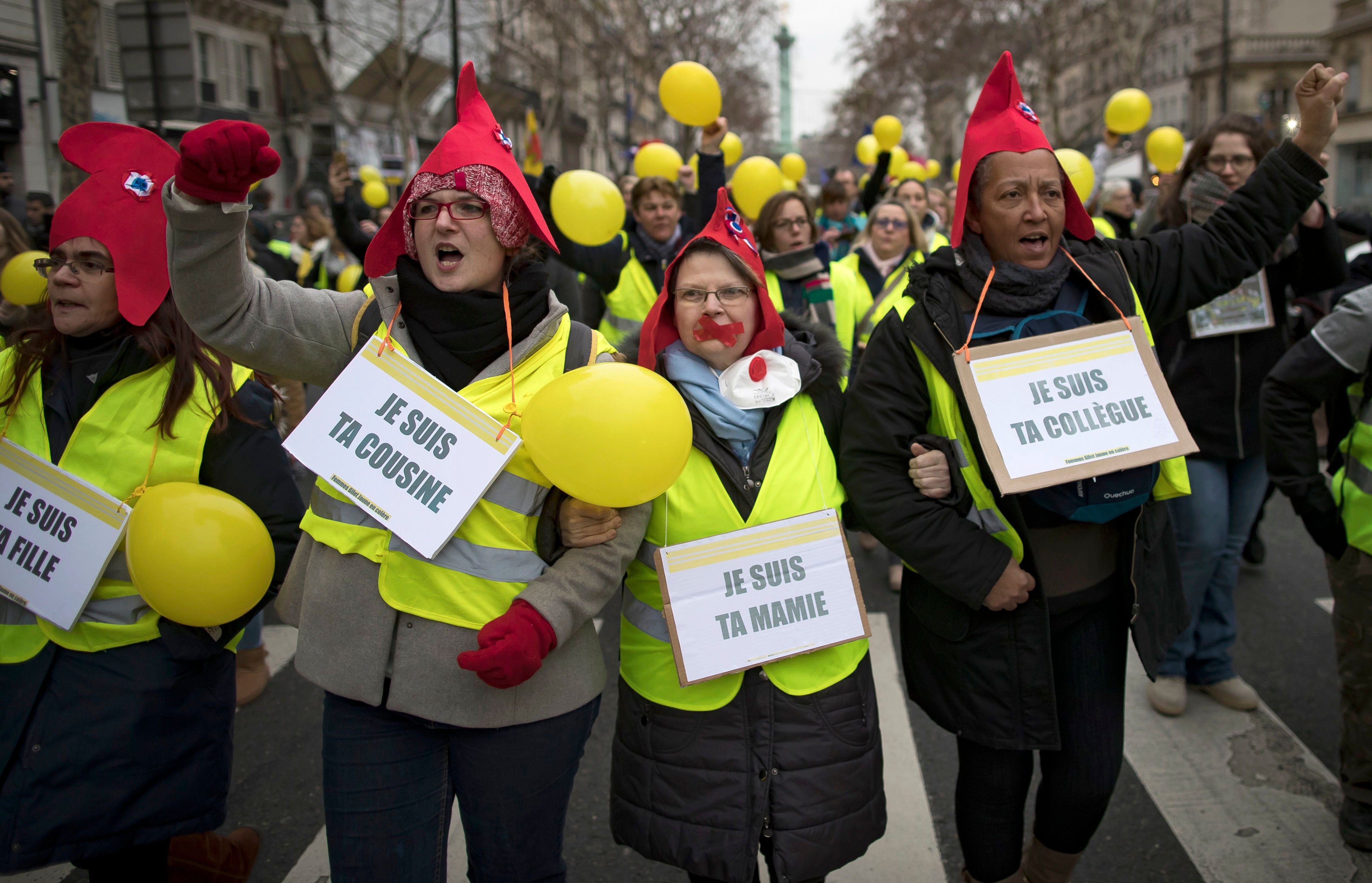 Protesters, wearing French revolutionnary Phrygian caps, take part in a protest march during a women's 'Gilets Jaune' (Yellow Vests) between Place de la Bastille and Republique, in Paris, France, on Jan. 6, 2018. (IAN LANGSDON—EPA-EFE/REX/Shutterstock)