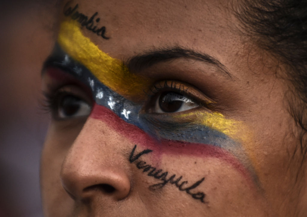Venezuelans opposed to President Nicolas Maduro hold a demonstration in Medellin, Colombia in support of opposition leader Juan Guaido's self-proclamation as acting president of Venezuela, on Jan. 23, 2019. (Joaquin Sarmiento—AFP/Getty Images)