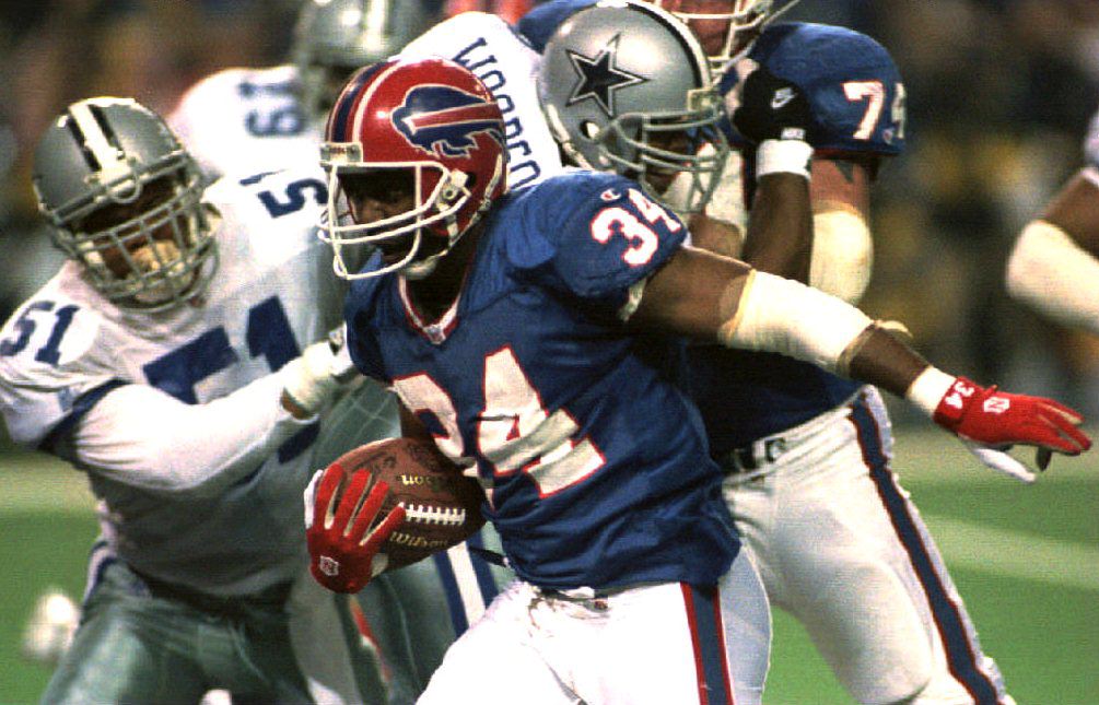 The Simpsons predict Super Bowl again in 1994. Here, the Buffalo Bills running back Thurman Thomas (C) eludes Dallas Cowboys defenders during Super Bowl XXVIII. (Photo credit should read TIMOTHY CLARY/AFP/Getty Images) (TIMOTHY CLARY—AFP/Getty Images)