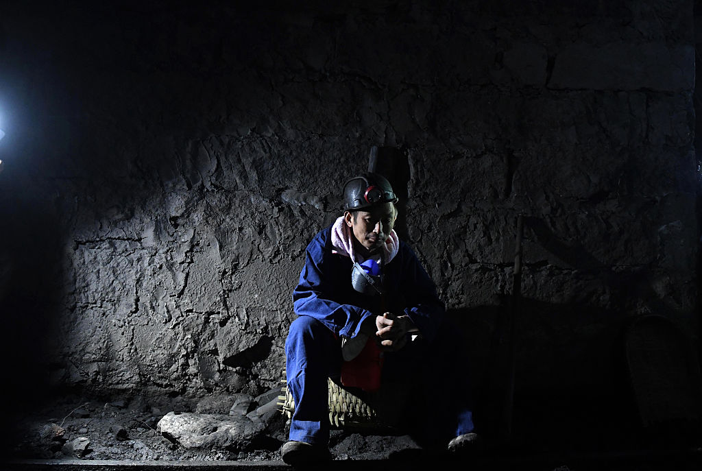 A rescuer waiting at the pithead of Jinshangou coal mine, where 33 miners were killed after a colliery explosion, in Yongchuan district of Chongqing, China on Oct. 31, 2016. (Stringer—AFP/Getty Images)