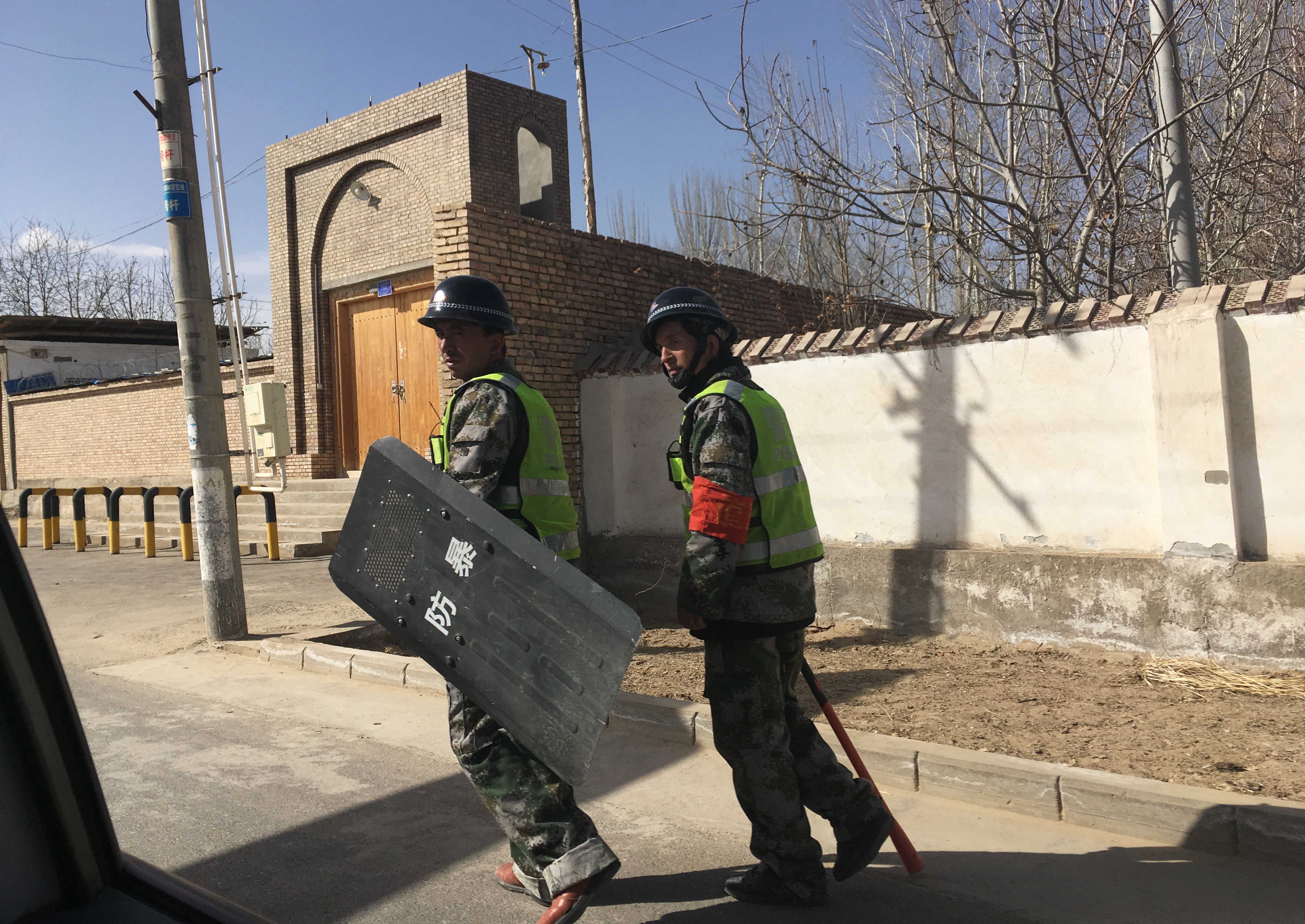 Police patrol a village in Hotan prefecture, in China's western Xinjiang region on Feb. 17, 2018. (Ben Dooley&mdash;AFP/Getty Images)
