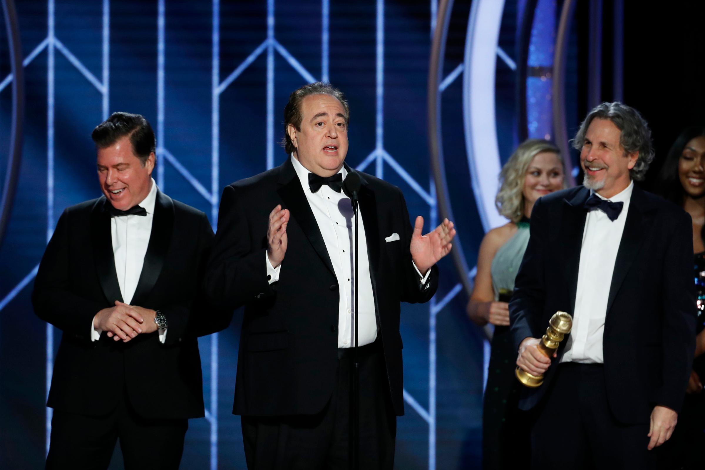 Brian Currie, Nick Vallelonga and Peter Farrelly of “Green Book” accept the Best Screenplay – Motion Picture award onstage during the 76th Annual Golden Globe Awards.