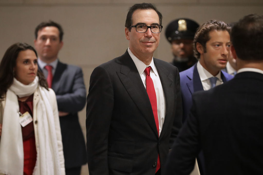 U.S. Treasury Secretary Steven Mnuchin arrives with his Chief of Staff Eli Miller for a classified briefing with a group of bipartisan members of Congress on Jan. 10, 2019 in Washington, DC. If the government shutdown continues it could impact America's credit rating. (Chip Somodevilla—Getty Images)