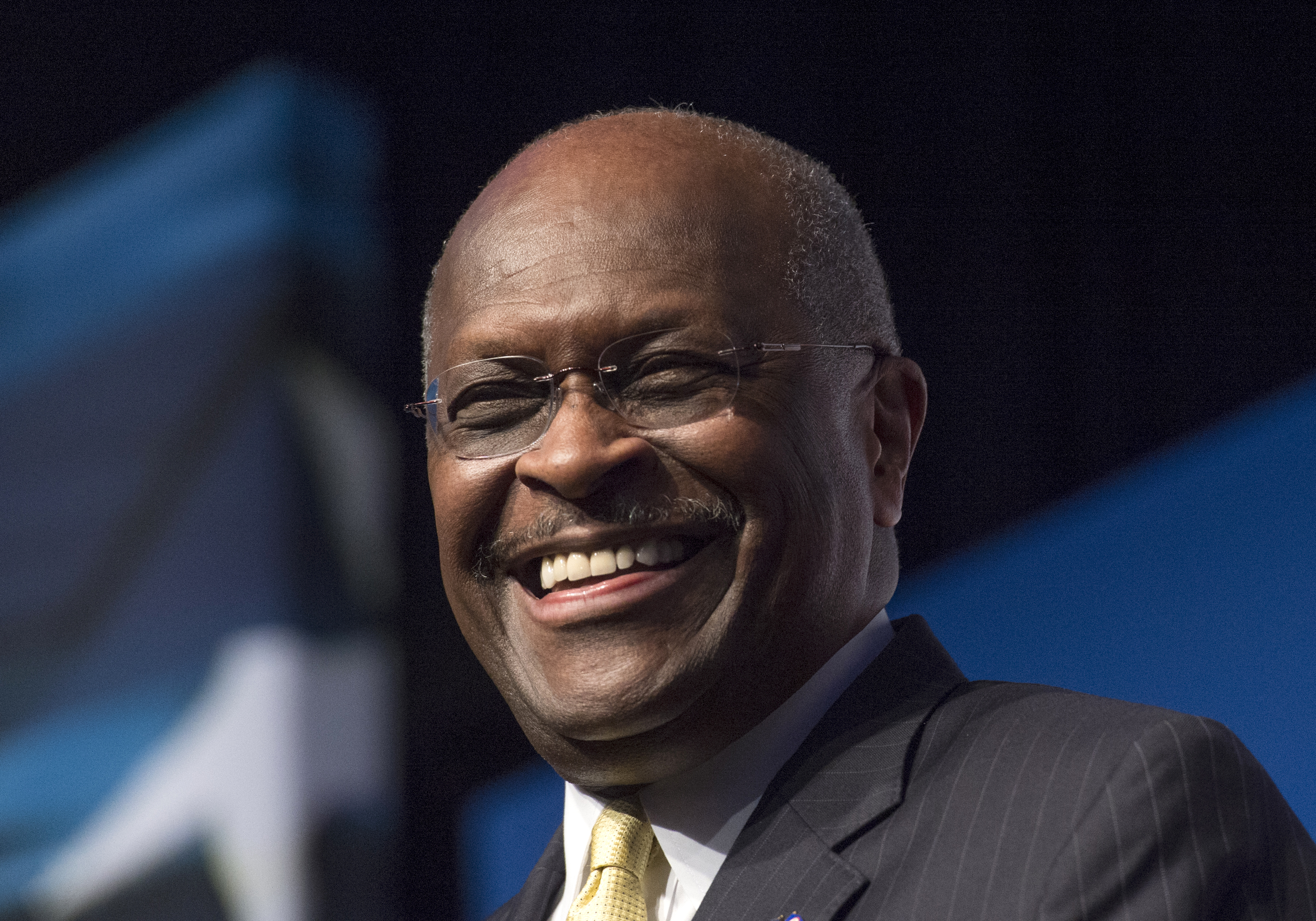Herman Cain, CEO, The New Voice, speaks during Faith and Freedom Coalition's Road to Majority event in Washington on June 20, 2014. On Jan. 31, 2019 it was reported that President Donald Trump is considering Cain to fill one of the vacant seats on the Federal Reserve Board. (Molly Riley—AP)