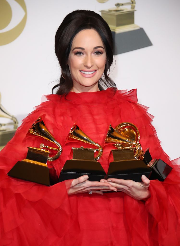 Kacey Musgraves poses in the press room with her awards for Best Country Solo Performance for 'Butterflies,' Best Country Song for 'Space Cowboy,' Best Country Album for 'Golden Hour,' and Album of The Year for 'Golden Hour,' during the 61st Annual GRAMMY Awards at the Staples Center on February 10, 2019 in Los Angeles, California. (Dan MacMedan—Getty Images)