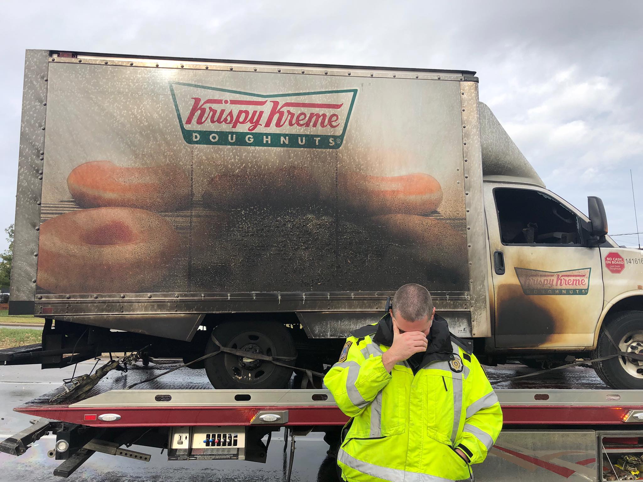 A police officer reacts to a Krispy Kreme truck that caught on fire in Lexington, Ky., on Dec. 31. Nobody was hurt, but local officers had fun on twitter after the incident. (Lexington Police Department)