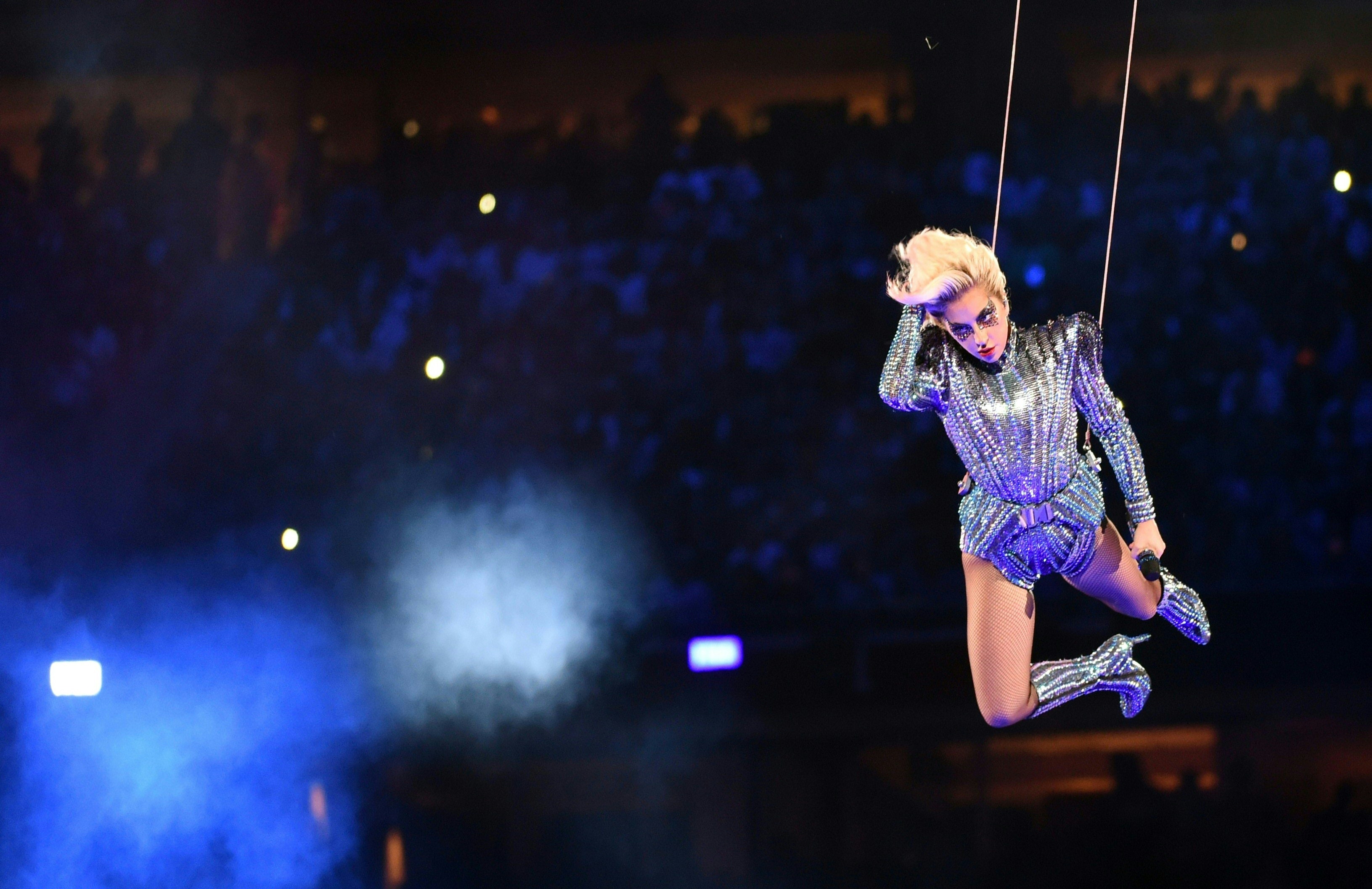 Singer Lady Gaga performs during the halftime show of Super Bowl LI at NGR Stadium in Houston, Texas, on February 5, 2017. / AFP PHOTO / Timothy A. CLARY (Photo credit should read TIMOTHY A. CLARY/AFP/Getty Images)