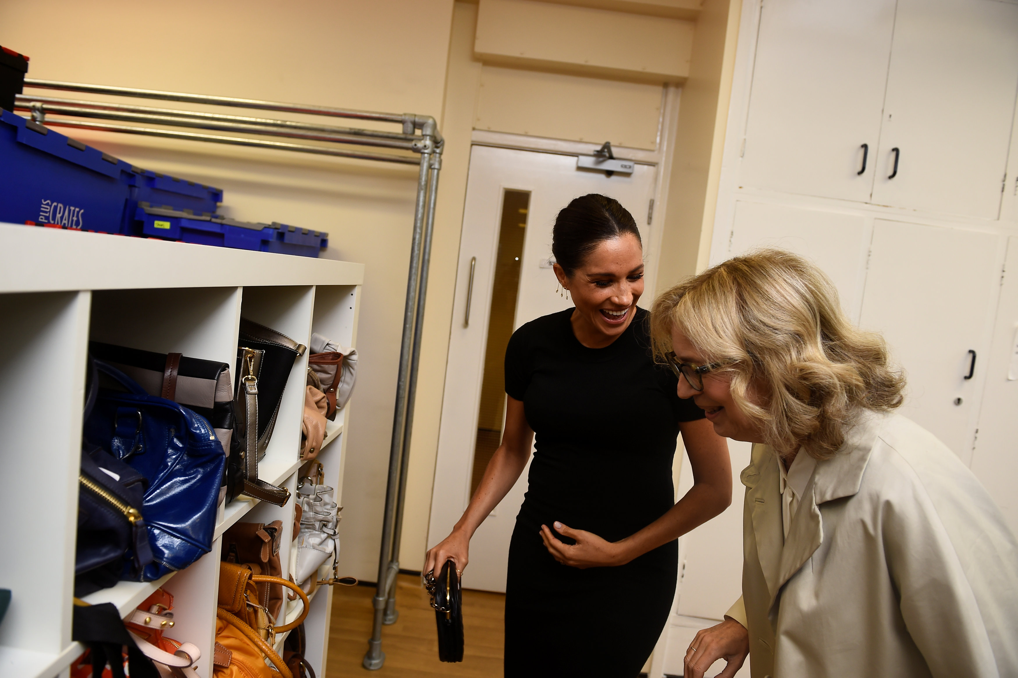 Meghan, Duchess of Sussex reacts as she looks at bags with Lady Juliet Hughes-Hallett during her visit to Smart Works on January 10, 2019 in London, United Kingdom. Smart Works is one of the four organizations which she has become Royal Patron of it was announced today by Kensington Palace. The three other organisations are The National Theatre, The Association of Commonwealth Universities (ACU) and Mayhew. (Photo by Clodagh Kilcoyne - WPA Pool/Getty Images) (WPA Pool—Getty Images)