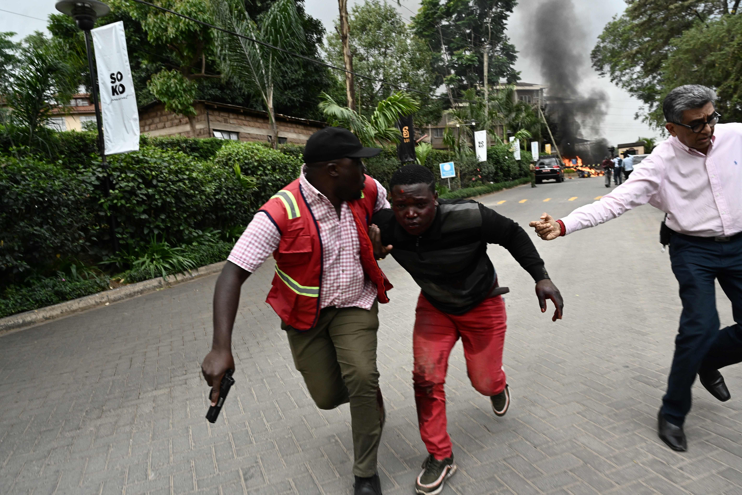 An injured man is evacuated from the scene of an explosion at a hotel complex in Nairobi. (Simon Maina—AFP/Getty Images)