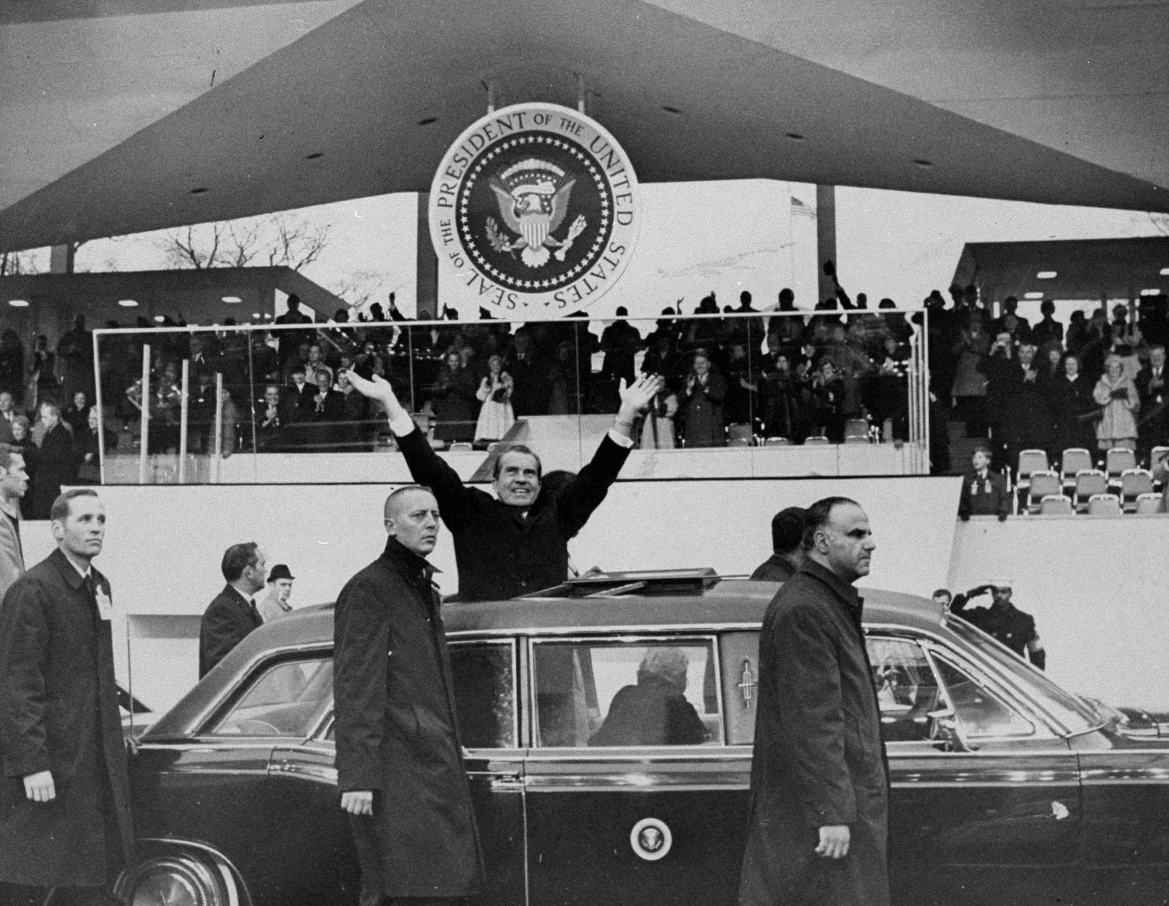 President Richard Nixon stands in car during the inaugural p