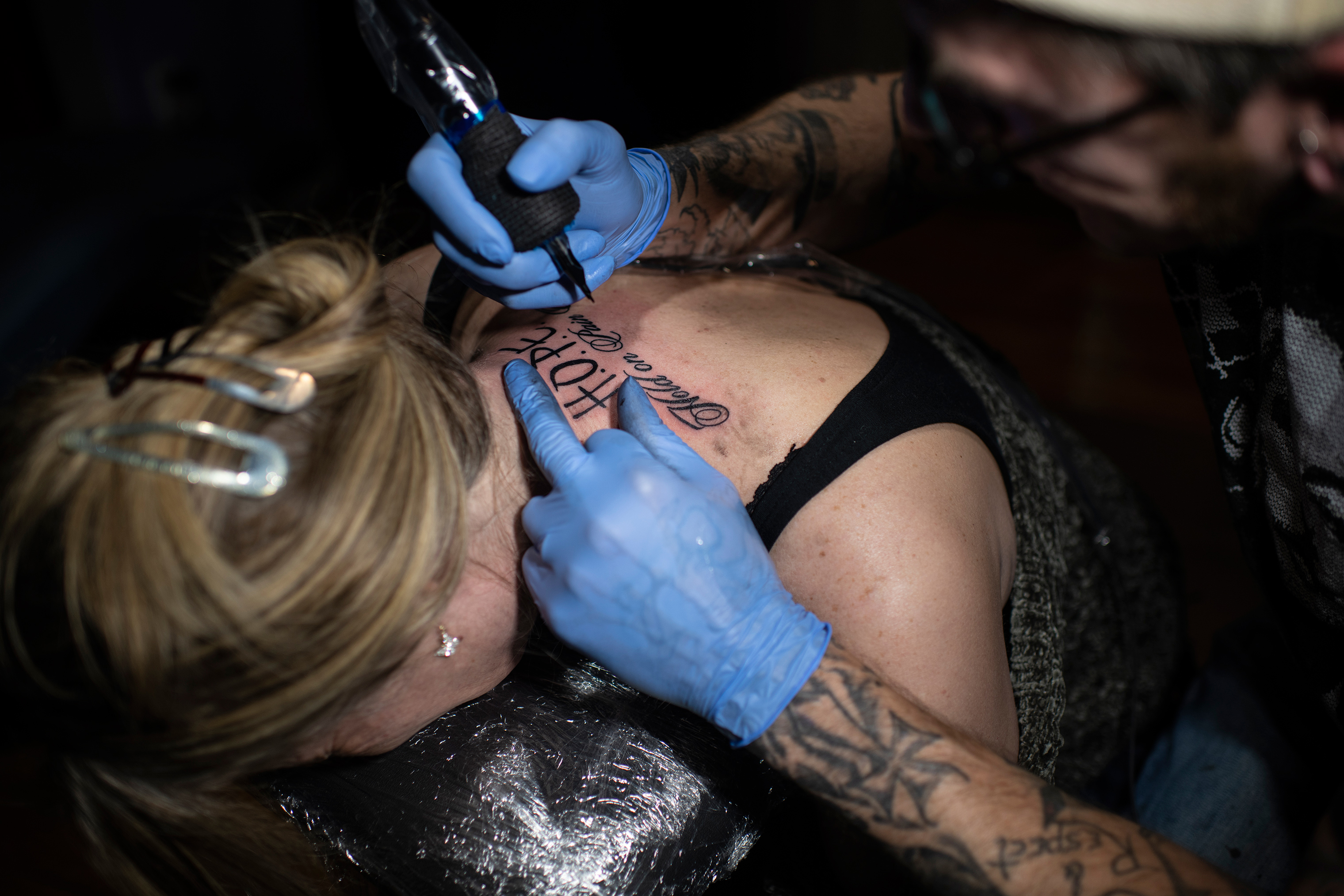 Knoblauch gets a tattoo in April to commemorate her freedom from traffickers (Lynsey Addario for TIME)