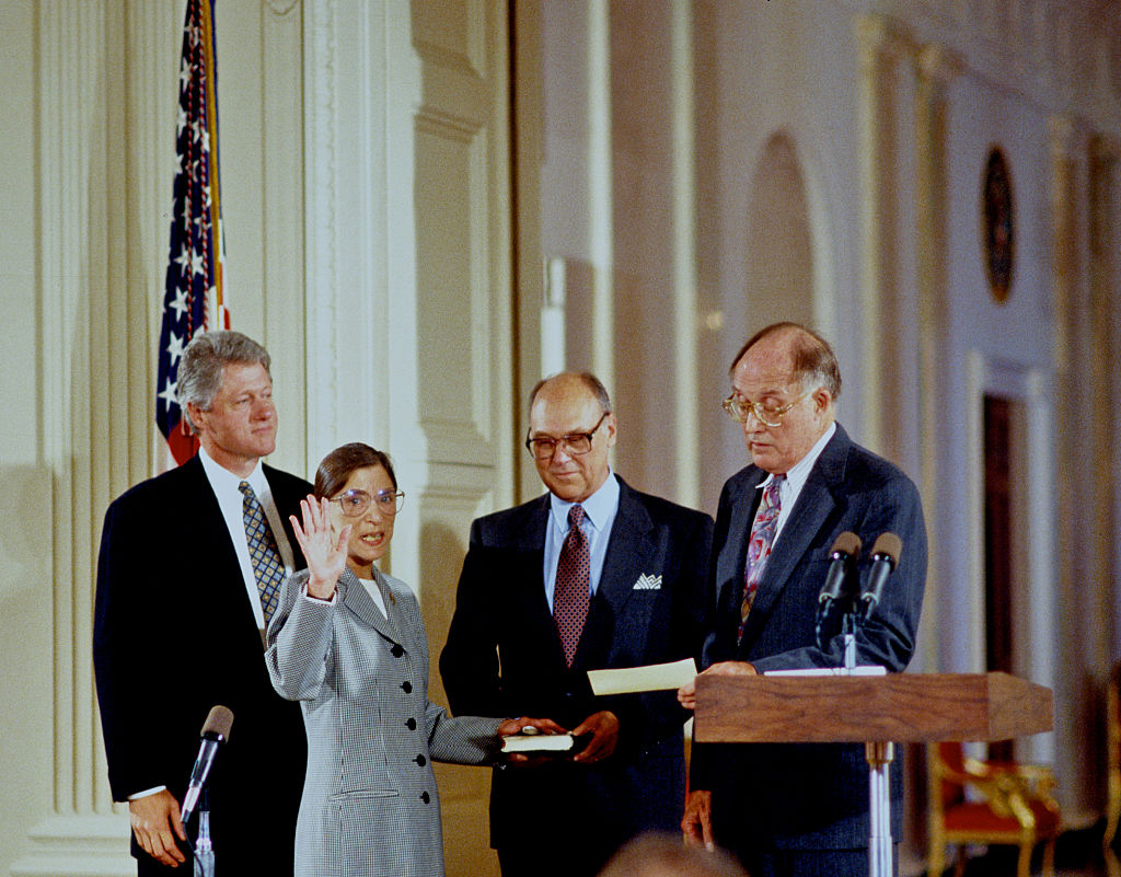 Ruth Bader Ginsberg is sworn in as Associate Justice of the Supreme Court of the United States, as President Bill Clinton stands behind her and her husband, Martin, holds the bible in 1993. (Mark Reinstein—Corbis/Getty Images)