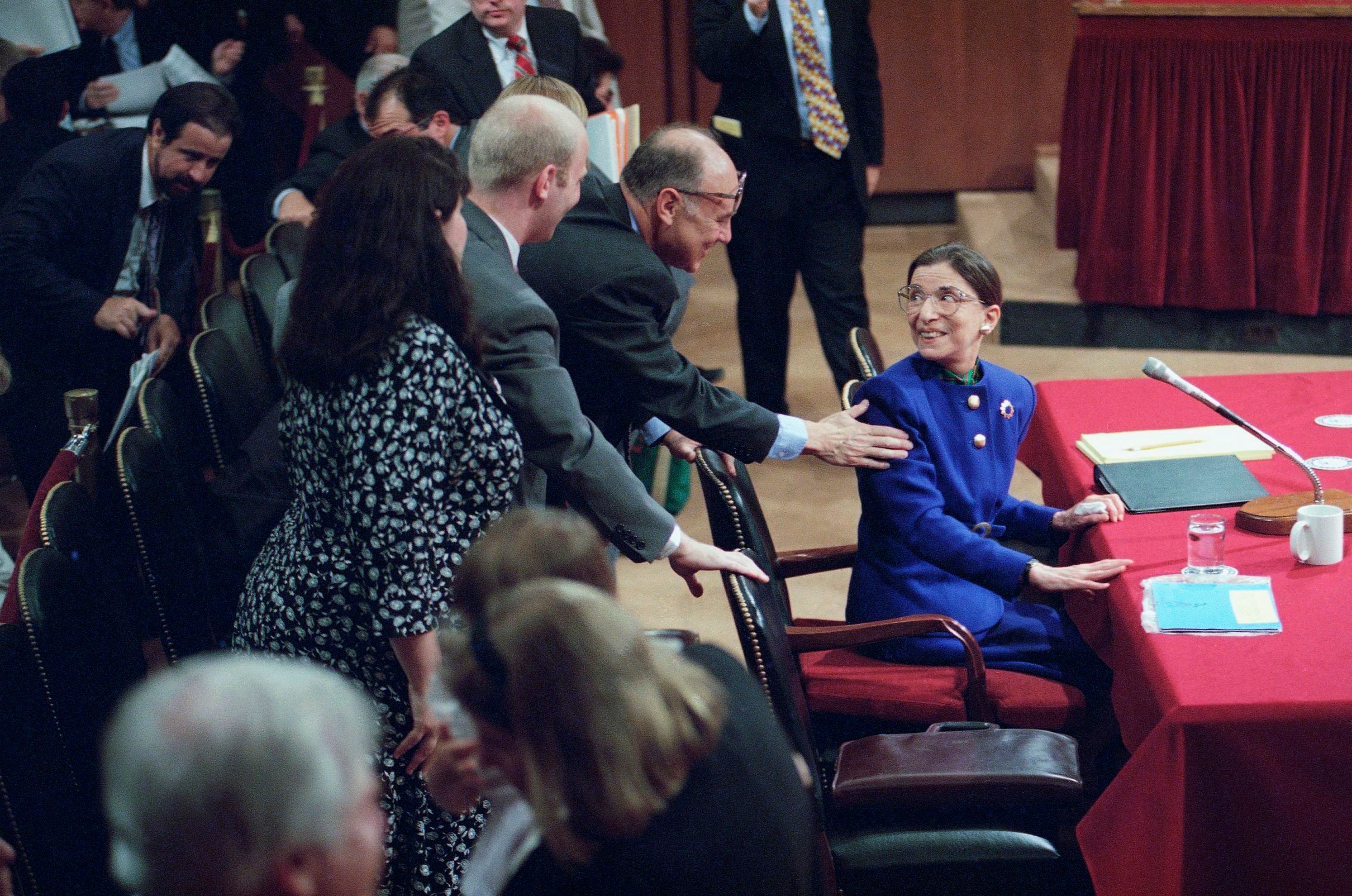 Judge Ruth Bader Ginsburg, then a Supreme Court nominee, is greeted by her husband, Martin, as she introduced her family during her confirmation hearing before the Senate Judiciary Committee on Capitol Hill in Washington on July 20, 1993. (John Duricka—AP/REX/Shutterstock)