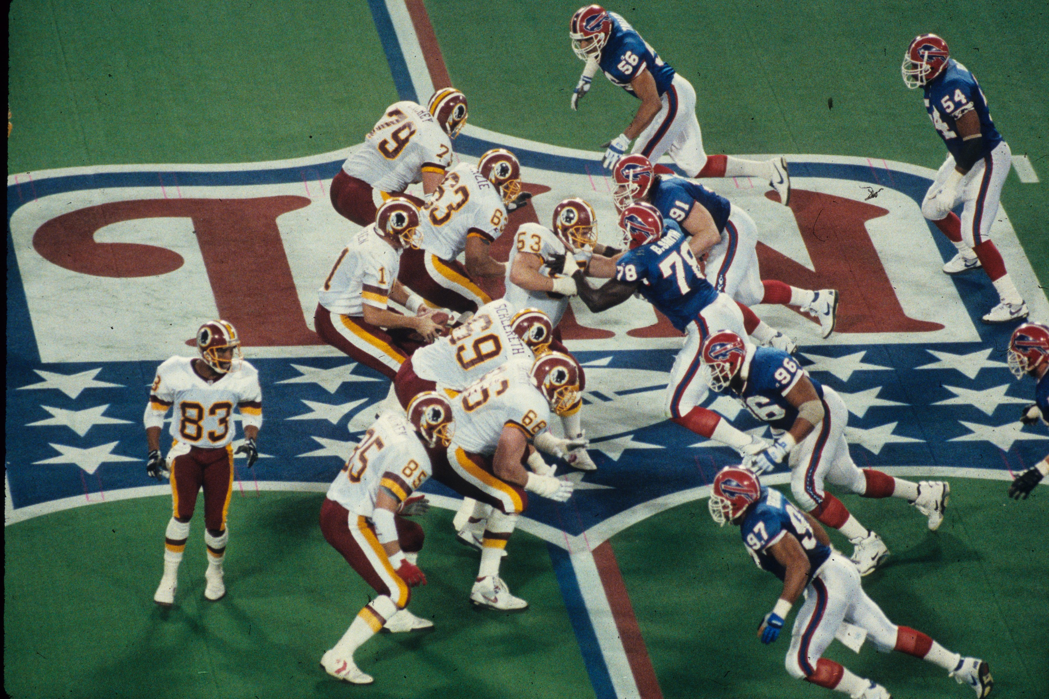 The Simpsons predict the Super Bowl again. Quarterback Mark Rypien #11 of the Washington Redskins drops back to pass against the Buffalo Bills in Super Bowl XXVI at the Metrodome on January 26, 1992 in Minneapolis, Minnesota. The Redskins defeated the Bills 37-24. (Photo by Gin Ellis/Getty Images) (Gin Ellis&mdash;NFL)