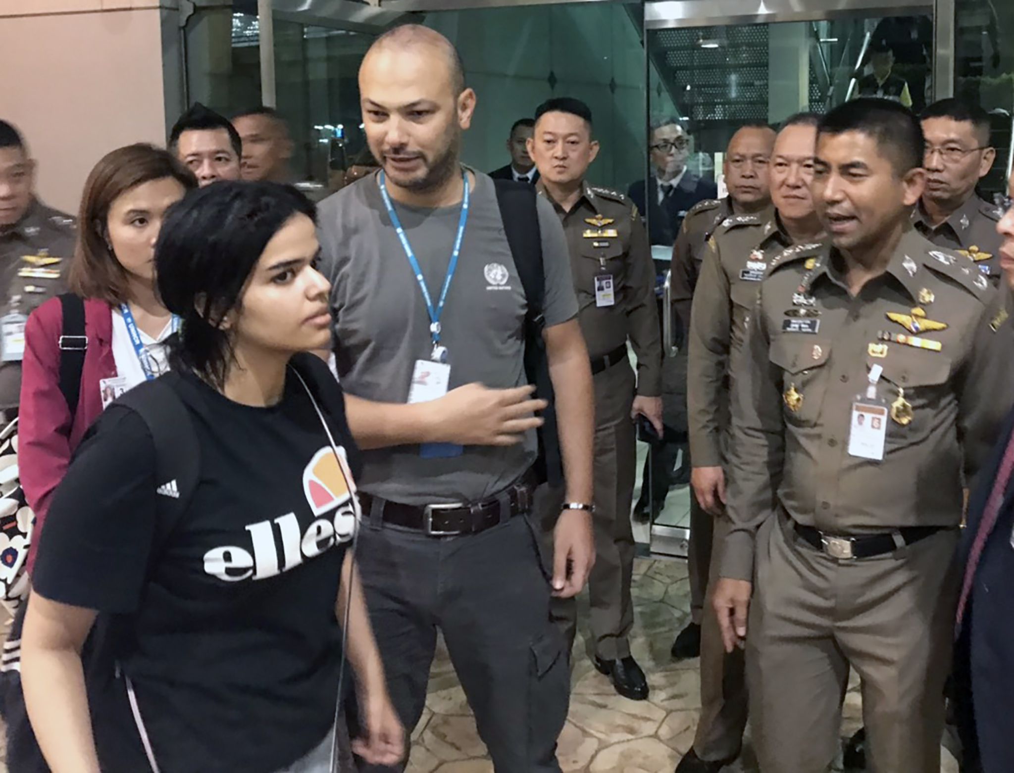 A handout photo made available by the Thai Immigration Bureau shows Saudi woman who seeking for asylum Rahaf Mohammed al-Qunun talks with Thai Immigration Police Chief Surachet Hakparn at the Suvarnabhumi international airport in Samut Prakan province, on the outskirts of Bangkok, Thailand, on Jan. 7, 2019. The Saudi teen was stopped at the airport as she was traveling to Australia for asylum after she claimed that she was abused by her family. (THAI IMMIGRATION BUREAU HANDOUT/EPA-EFE/REX/Shutterstock)