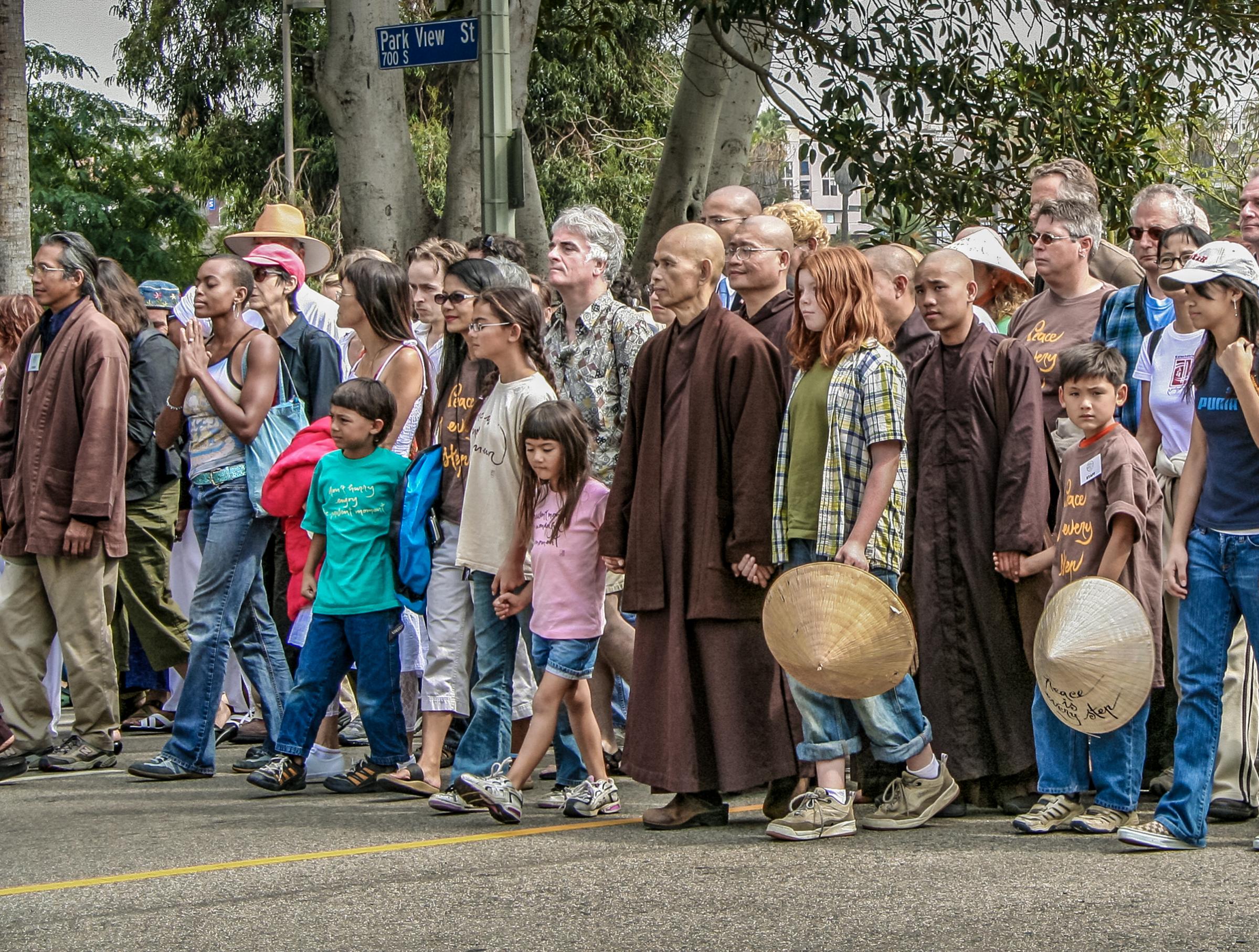 Nhat Hanh, center, led a silent peace walk in Los Angeles in 2005, as the Iraq War escalated