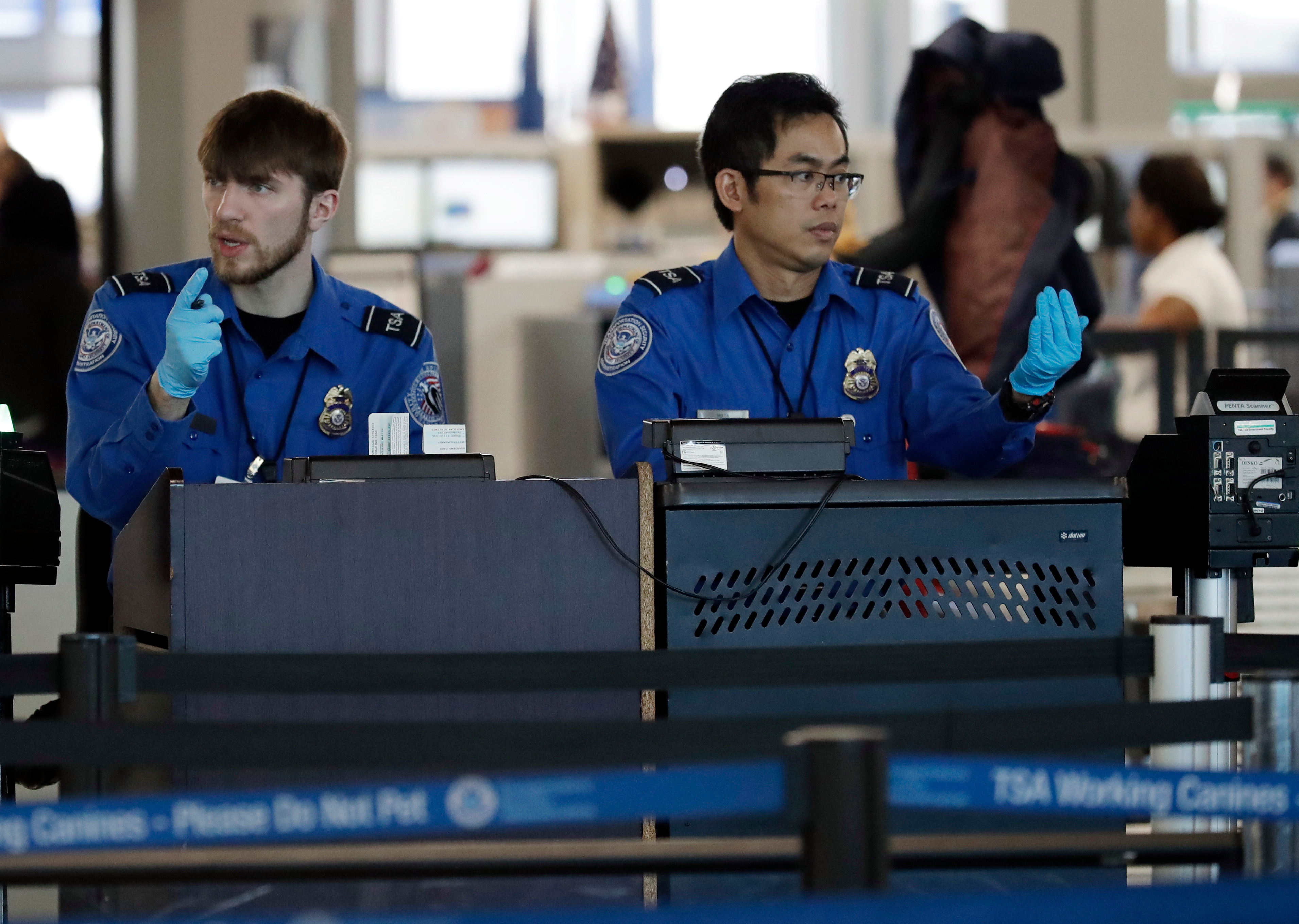 Transportation Security Administration officers work at a checkpoint at O'Hare airport in Chicago, Il. on Jan. 5, 2019. (Nam Y Huh—AP/REX/Shutterstock)
