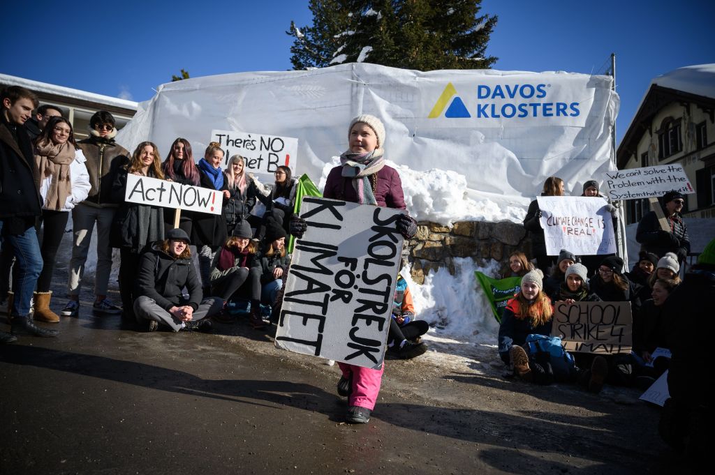 A Swedish climate activist holds a placard during a "School strike for climate" held near the World Economic Forum annual meeting, on Jan. 25, 2019 in Davos, Switzerland. (Fabrice Coffrini—AFP/Getty Images)