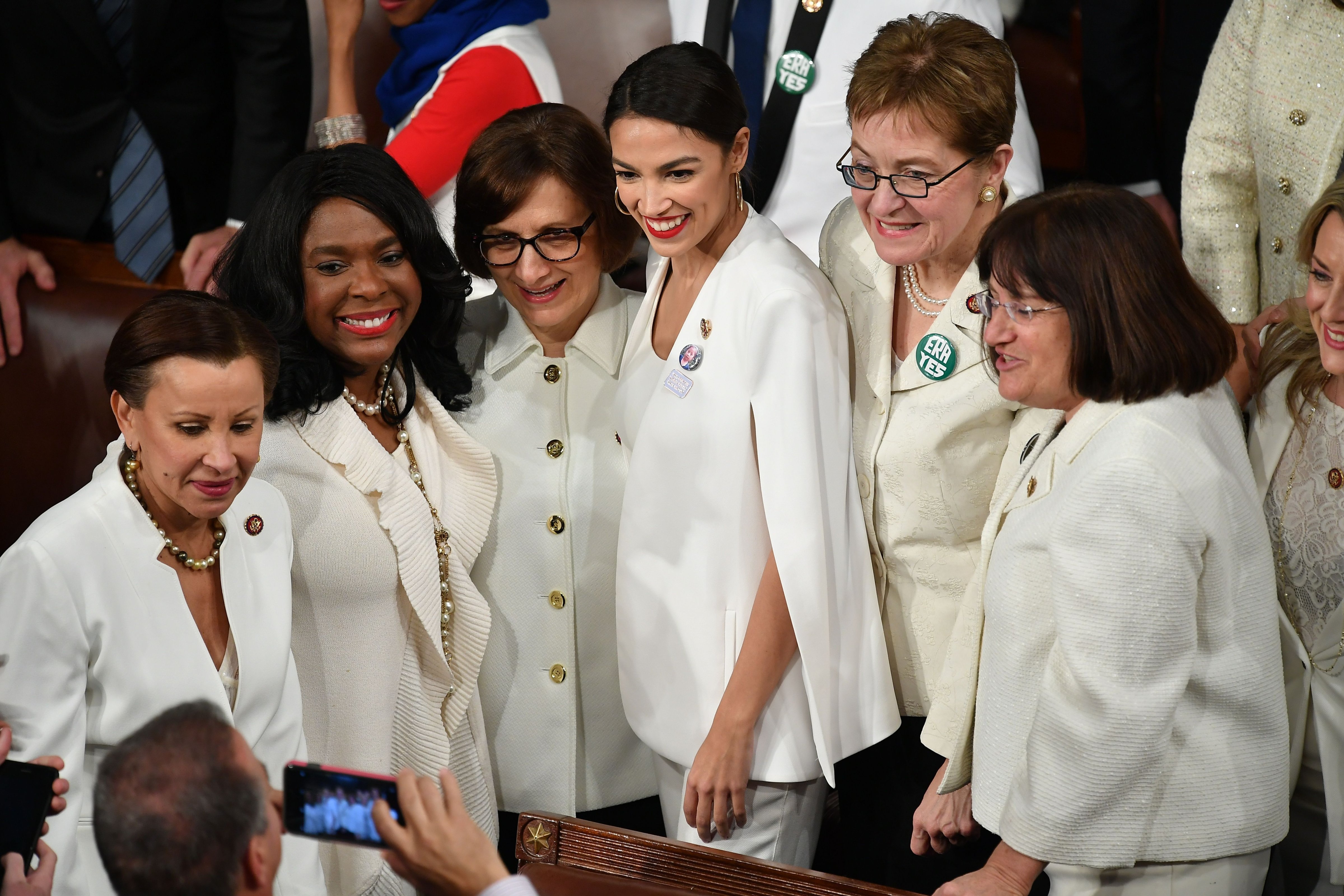 Alexandria Octavio-Cortez (C) poses for a picture with other women ahead of U.S. President Donald Trump's State of the Union address at the U.S. Capitol in Washington, DC, on February 5, 2019. Women from both political parties wore white outfits at the behest of the Democratic Women's Working Group to honor the legacy of women's suffrage in the United States. (MANDEL NGAN—AFP/Getty Images U.S. Rep)
