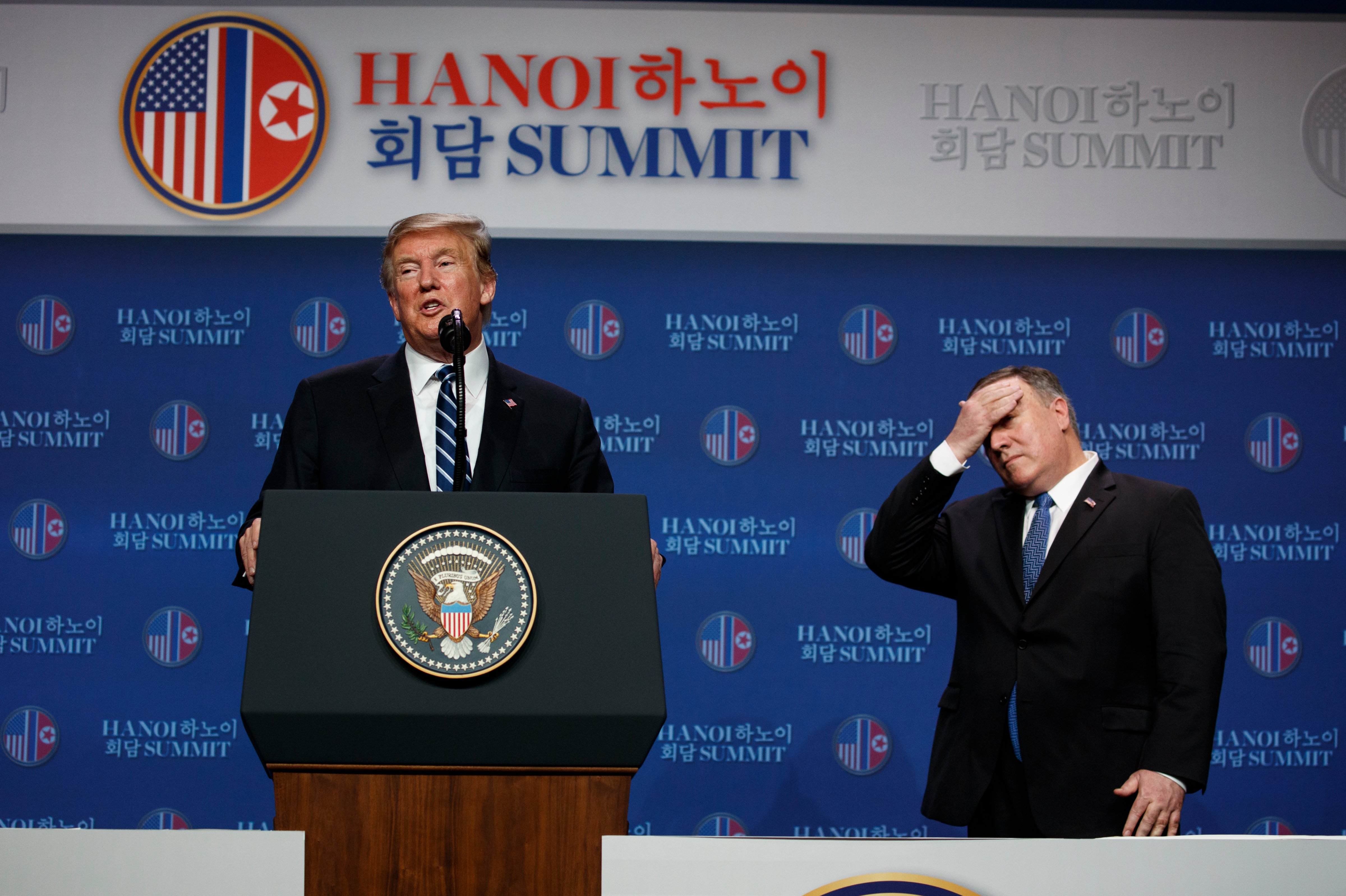 President Donald Trump speaks as Sec. of State Mike Pompeo looks on during a news conference after the summit on Feb. 28, 2019, in Hanoi Vietnam. (Evan Vucci—AP)