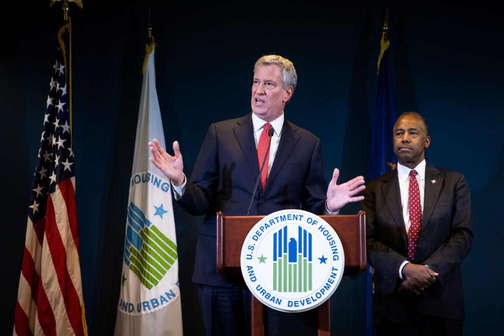 New York City Mayor Bill de Blasio and Ben Carson, Secretary of Housing and Urban Development (HUD), take questions after signing a ceremonial agreement between the federal government and the City of New York intended to correct mismanagement of the New York City Housing Authority (NYCHA), during a press conference at the Jacob Javits Federal Building, January 31, 2019 in New York City. On Sunday, de Blasio slammed Amazon.com Inc.’s decision to pull out of a second headquarters in the city as 'an example of an abuse of corporate power' that hurts working people. (Drew Angerer&mdash;Getty Images)