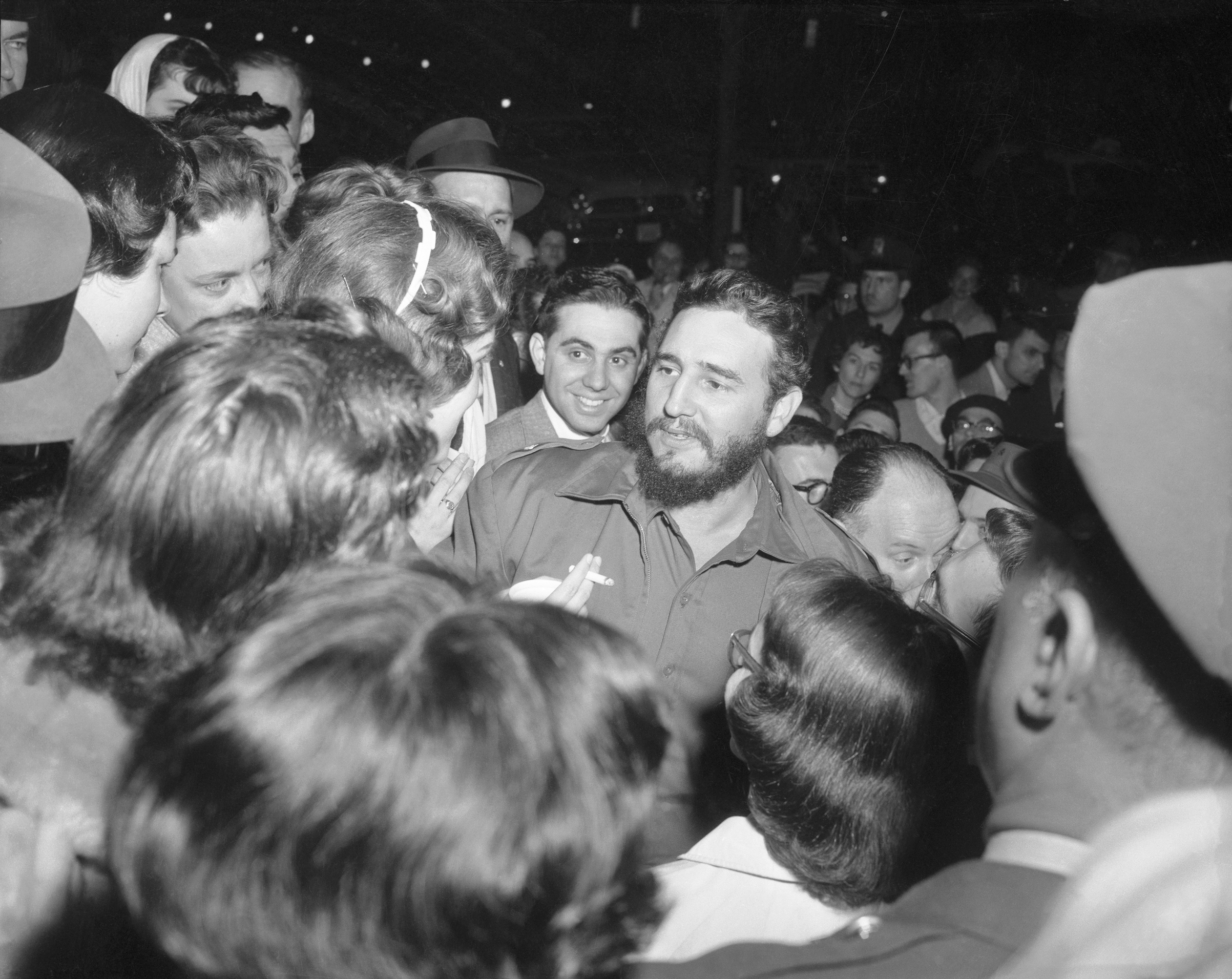 Cuban Prime Minister Fidel Castro greets admirers who waited for him across the street from the Cuban Embassy in Washington, D.C., in 1959. (Bettmann Archive/Getty Images)