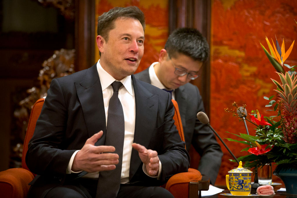 Tesla CEO Elon Musk speaks during a meeting with Chinese Premier Li Keqiang