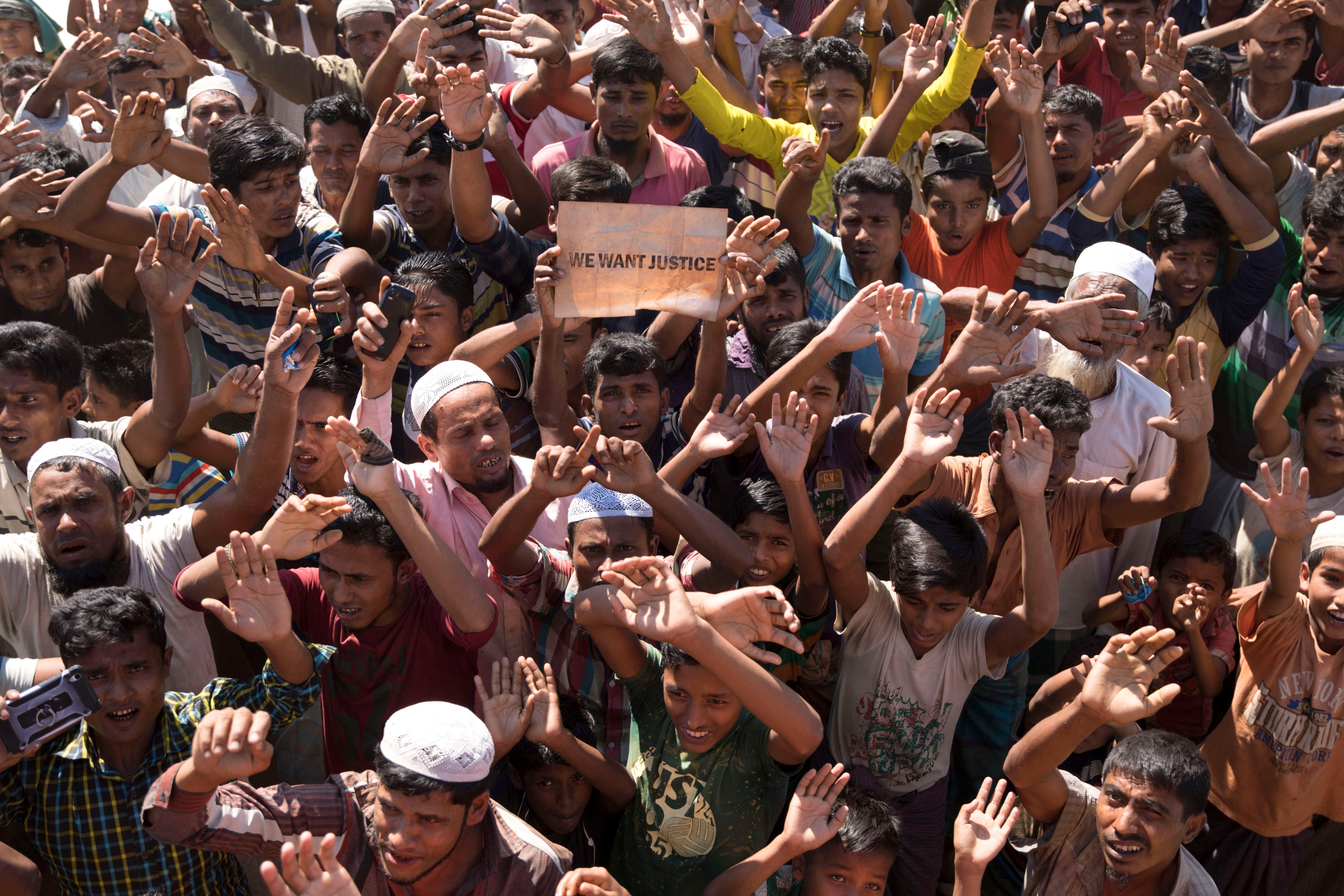 Rohingya people shouts slogans as they protest against the
