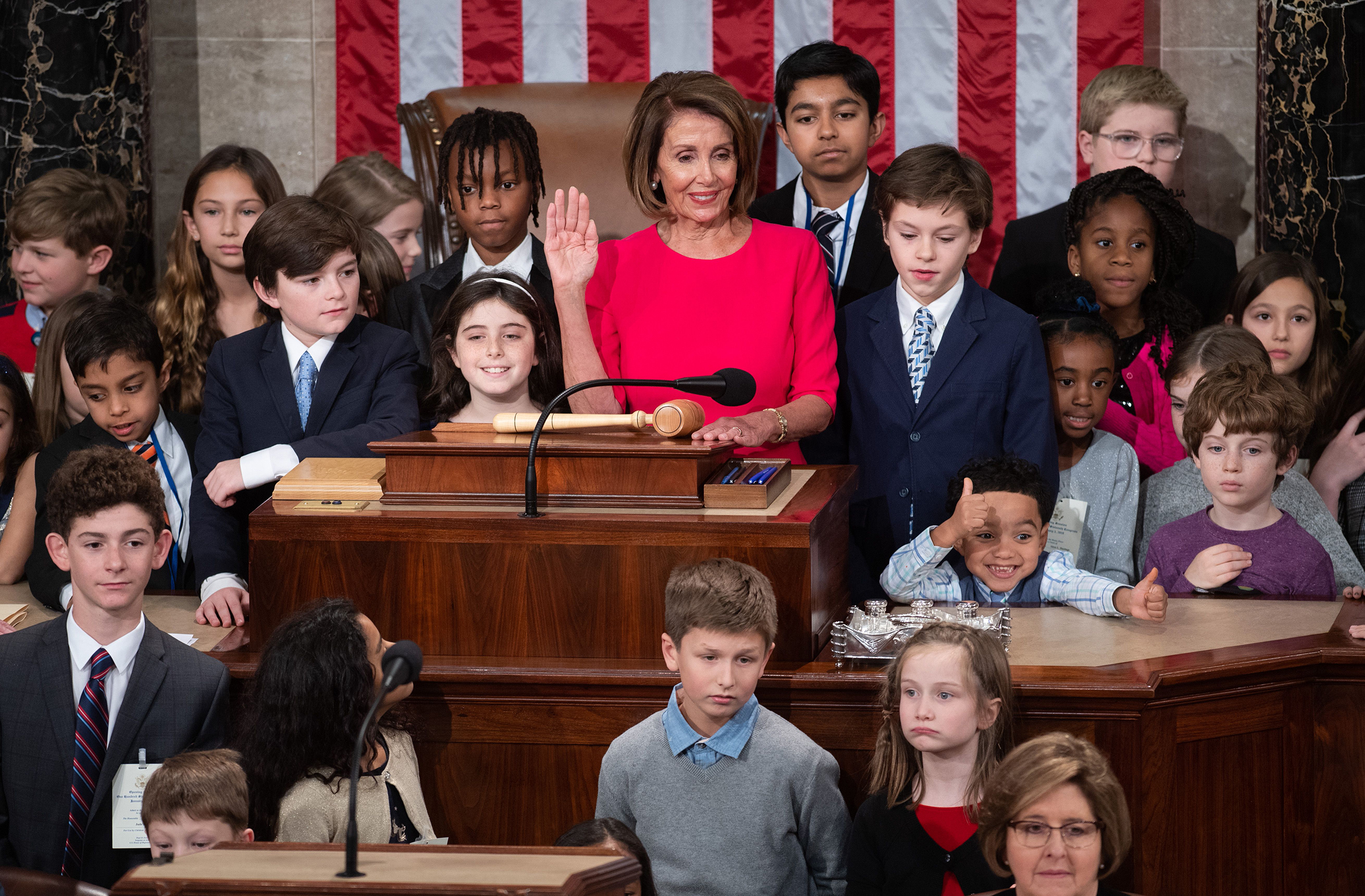 Incoming House Speaker Nancy Pelosi, surrounded by children and grandchildren of lawmakers, takes the oath at the closing of the 116th Congress at the US Capitol in Washington, on Jan. 3, 2019. (Saul Loeb—AFP/Getty Images)