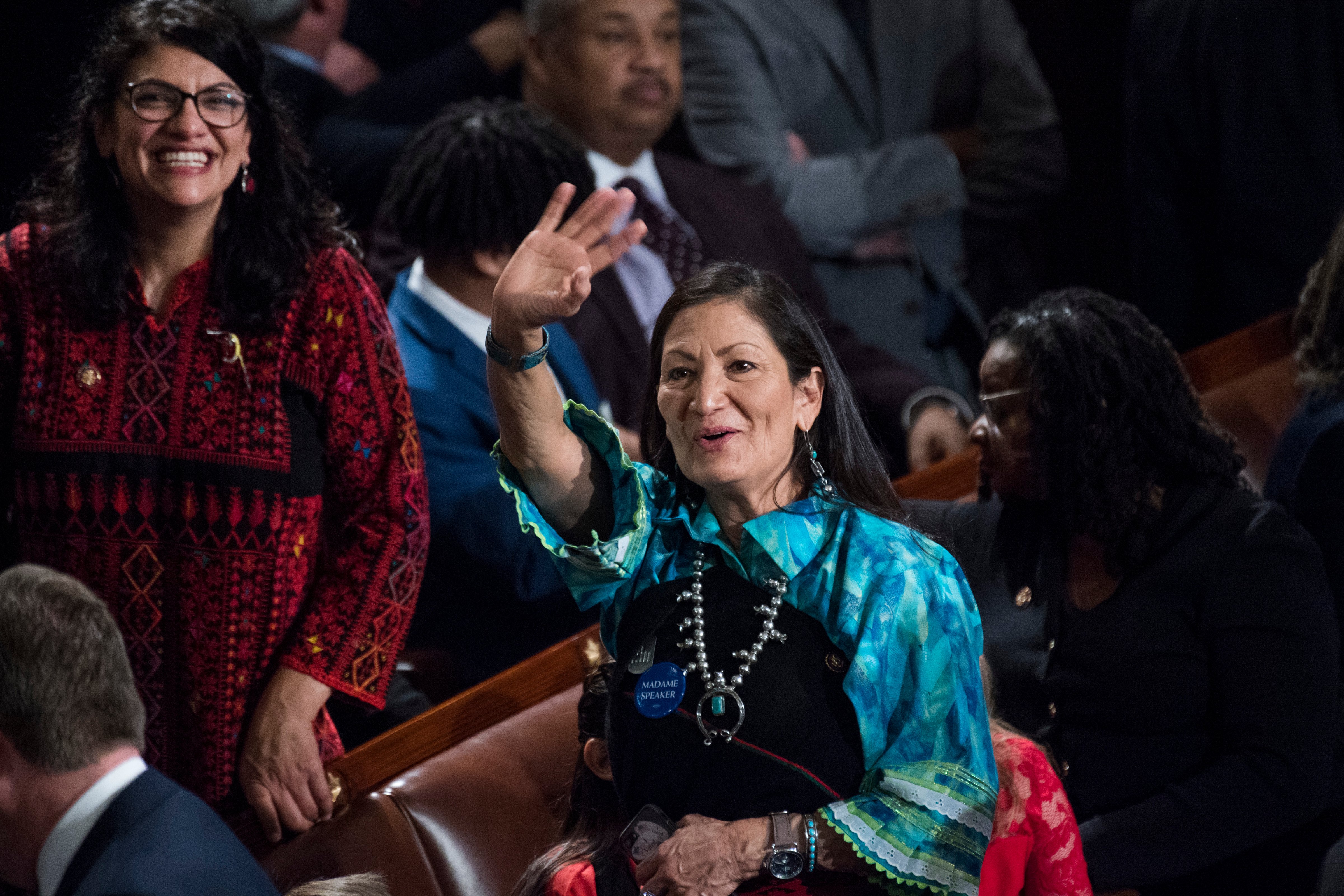 Reps. Deb Haaland, D-N.M., right, and Rashida Tlaib, D-N.M., left, are seen in the Capitol's House chamber. (Tom Williams—CQ-Roll Call/Getty Images)