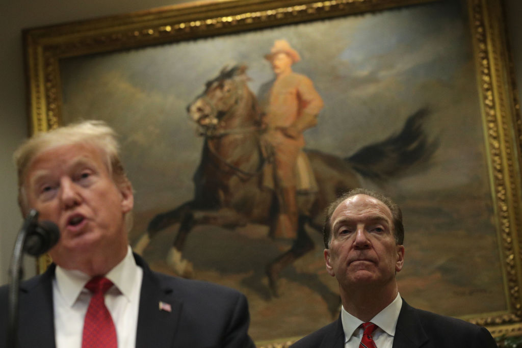 U.S. President Donald Trump speaks as Under Secretary of the Treasury for International Affairs David Malpass listens during a Roosevelt Room event at the White House Feb. 6, 2019 in Washington, DC (Alex Wong—Getty Images)