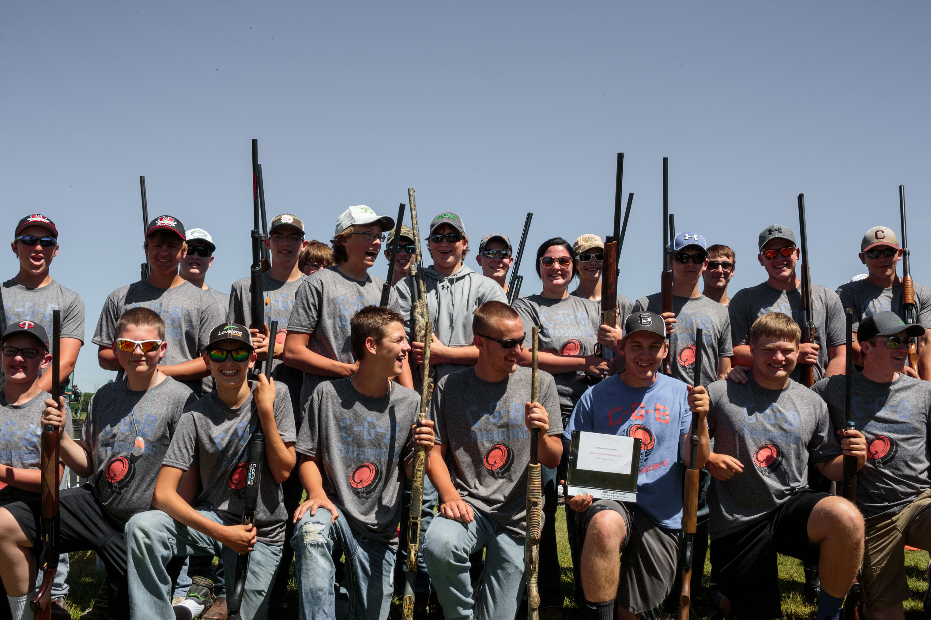 The C-G-B Trapshooting team lines up for a team photo. (Sarah Blesener for TIME)