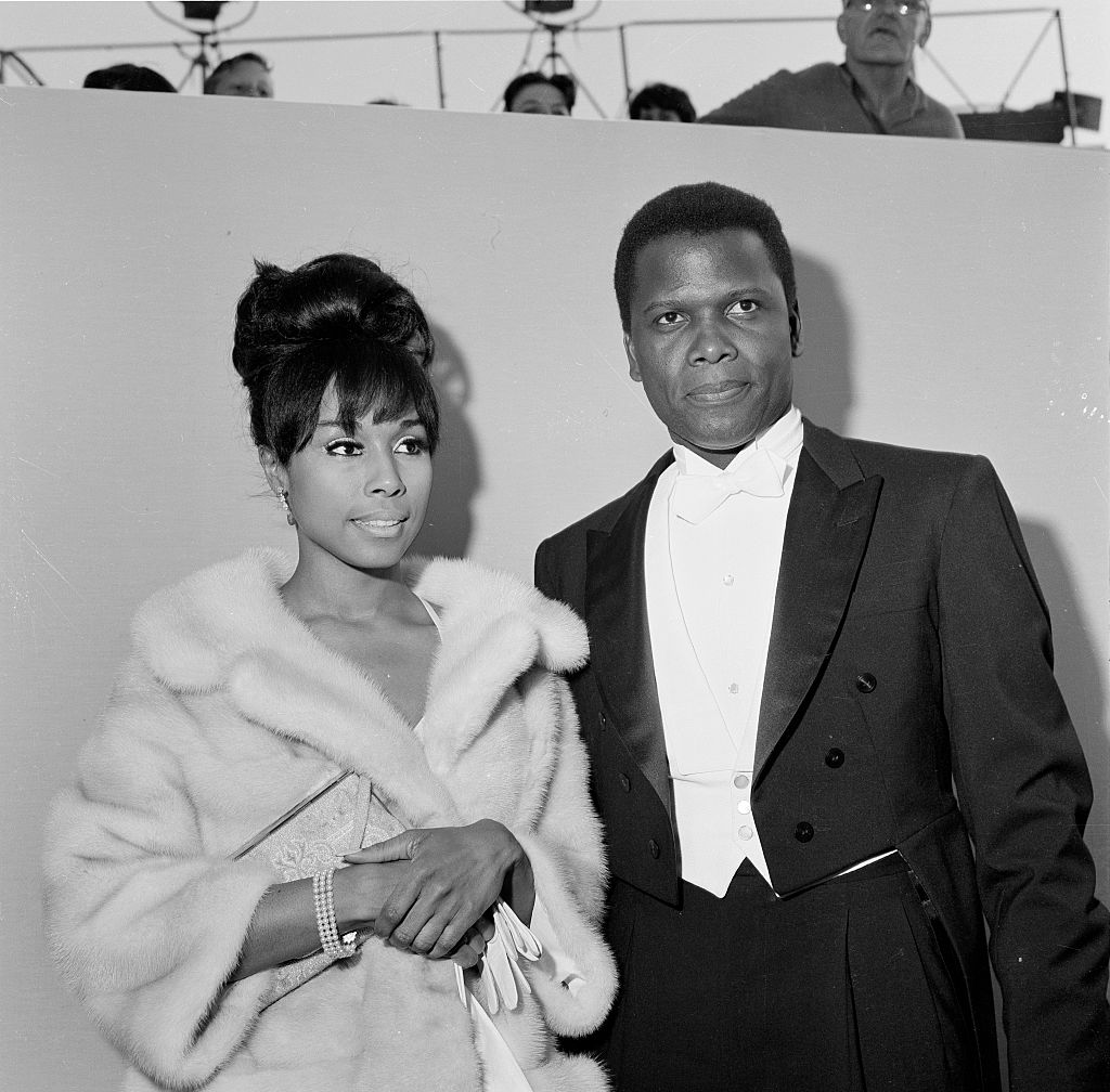 Actor Sidney Poitier with actress Diahann Carroll attend The 36th Academy Awards in Santa Monica, Calif., on April 13, 1964. (Michael Ochs Archives—Getty Images)