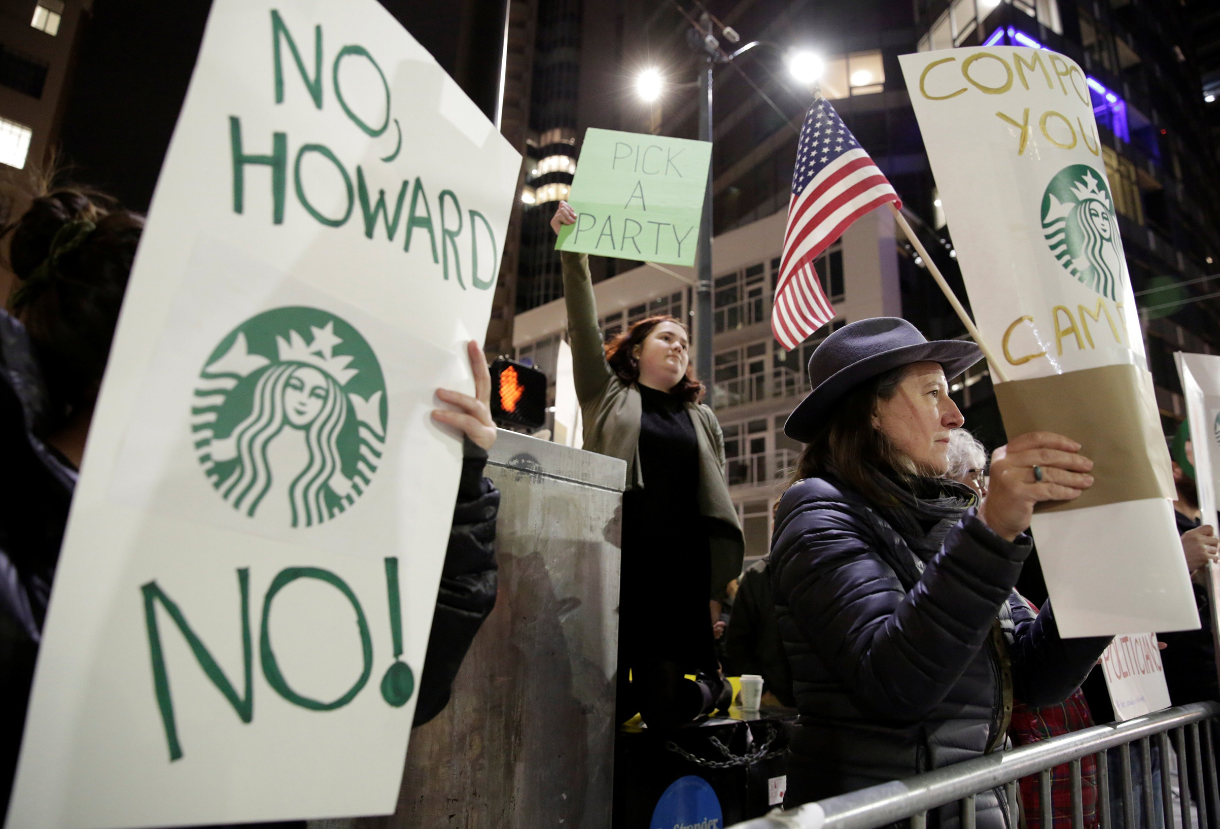 Protesters rally outside a Schultz book-tour stop in Seattle on Jan. 31 (Jason Redmond—Reuters)