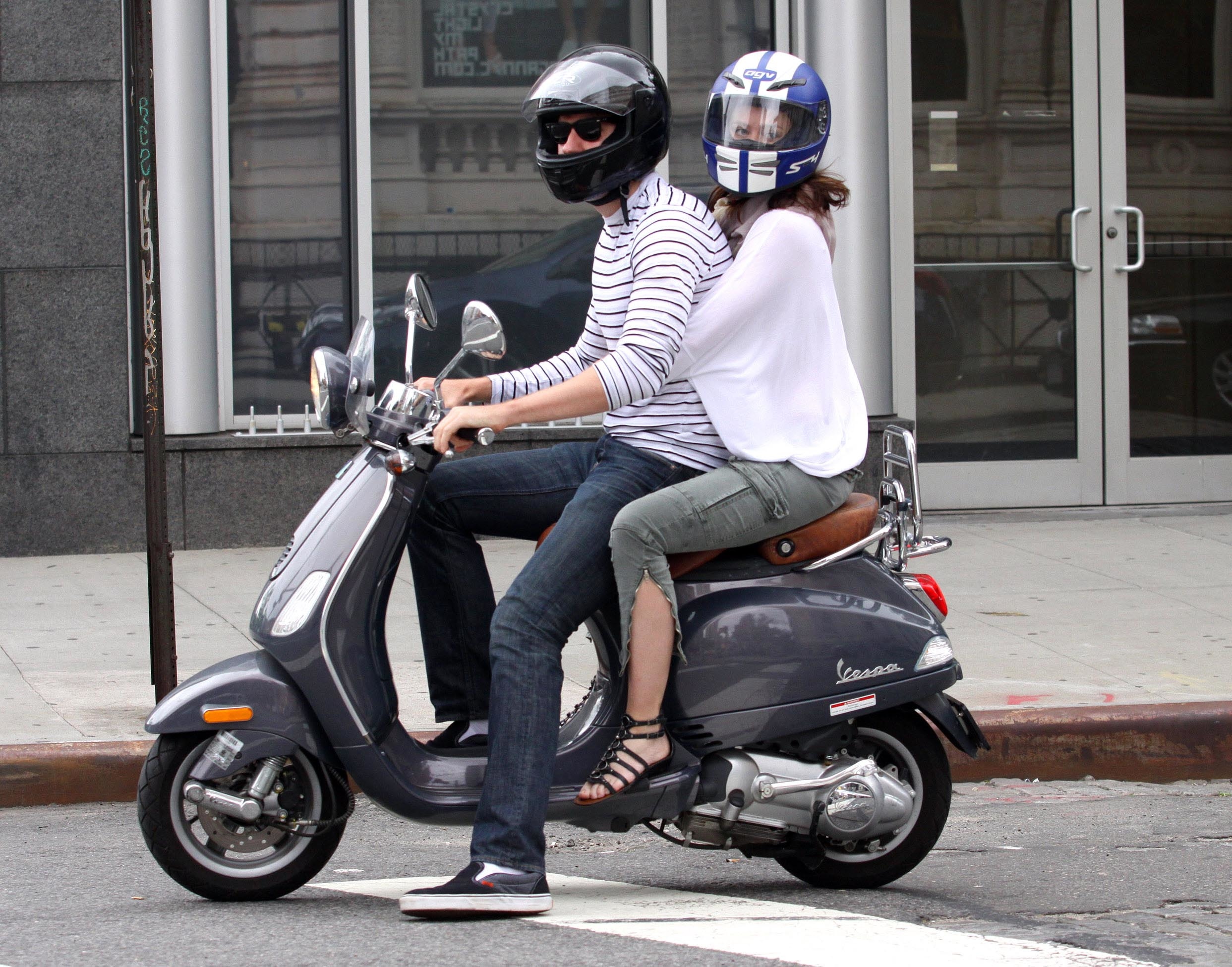 British actress EMILY BLUNT and fiancé JOHN KRASINSKI ride their Vespa scooter in the East Village, NYC. (Philip Ramey Photography, LLC—Corbis via Getty Images)