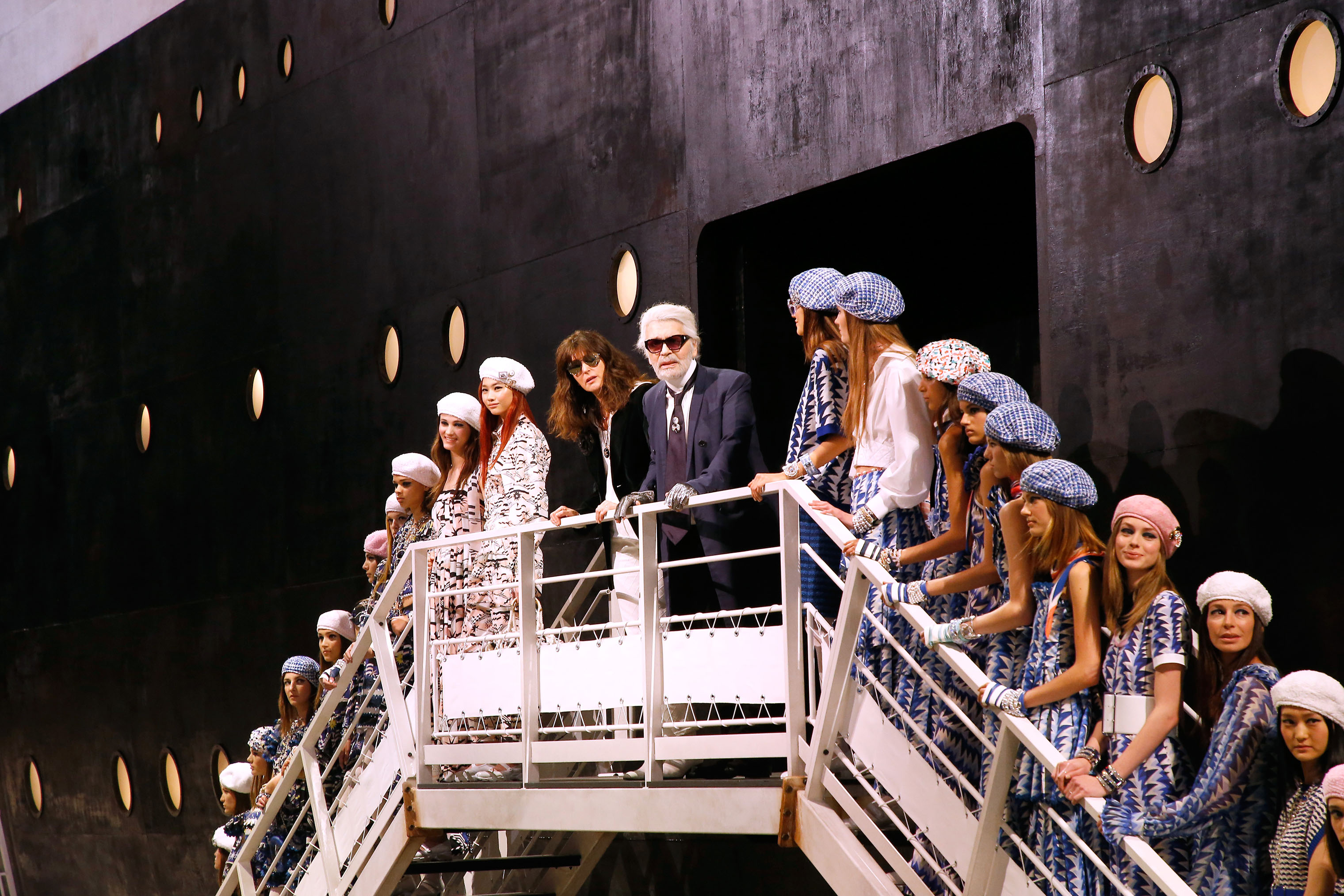 Stylist Karl Lagerfeld, director of Chanel creative studio Virginie Viard and models pose at the end of the Chanel Cruise 2018/2019 Collection at Le Grand Palais on May 3, 2018 in Paris, France. (Bertrand Rindoff Petroff—Getty Images)