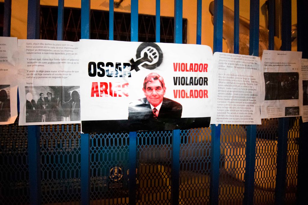 Signs at the entrance of the Arias Foundation for Peace. Nobel Peace Prize winner and Costa Rica's former President, Oscar Arias, has been accused of sexual assault. San Jose, Costa Rica, Feb. 8, 2019. (Ezequeil Becerra—AFP/Getty Images)