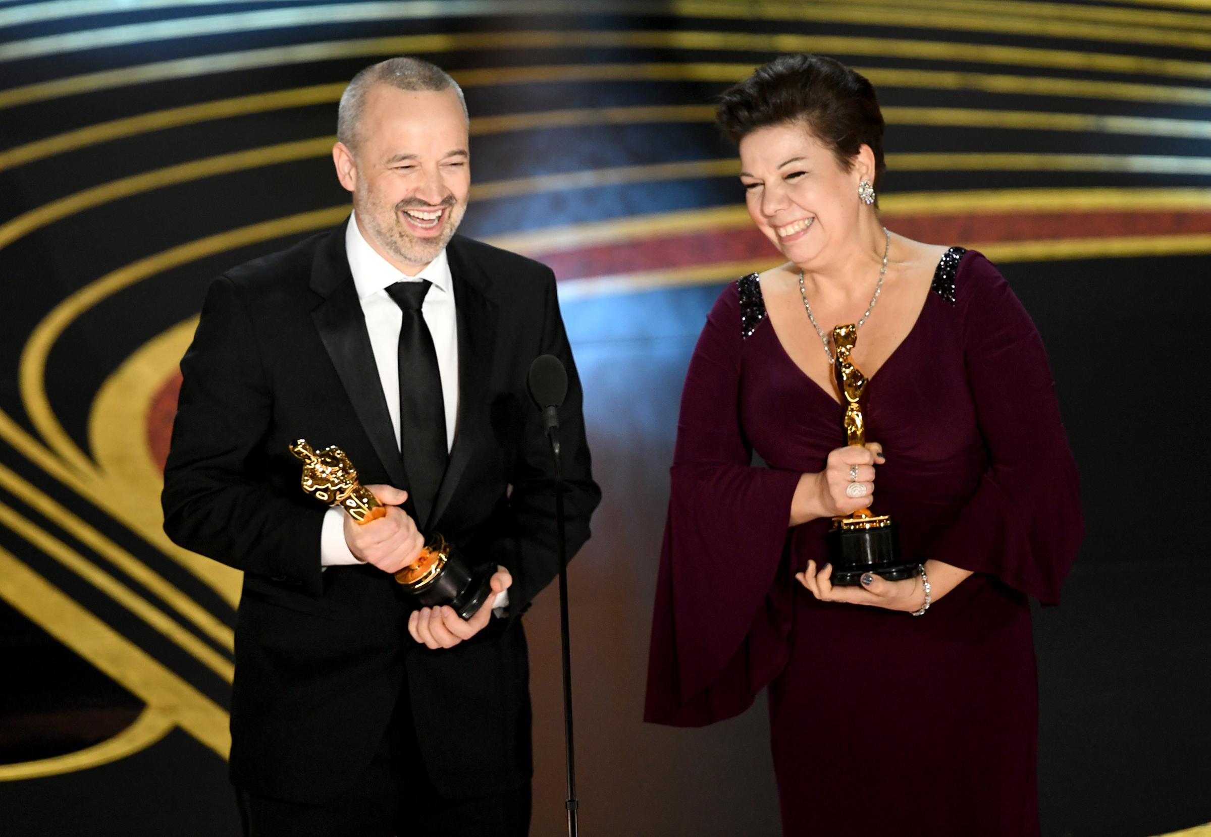 John Warhurst and Nina Hartstone accept the Sound Editing award for 'Bohemian Rhapsody' onstage during the 91st Annual Academy Awards at Dolby Theatre on Feb. 24, 2019.