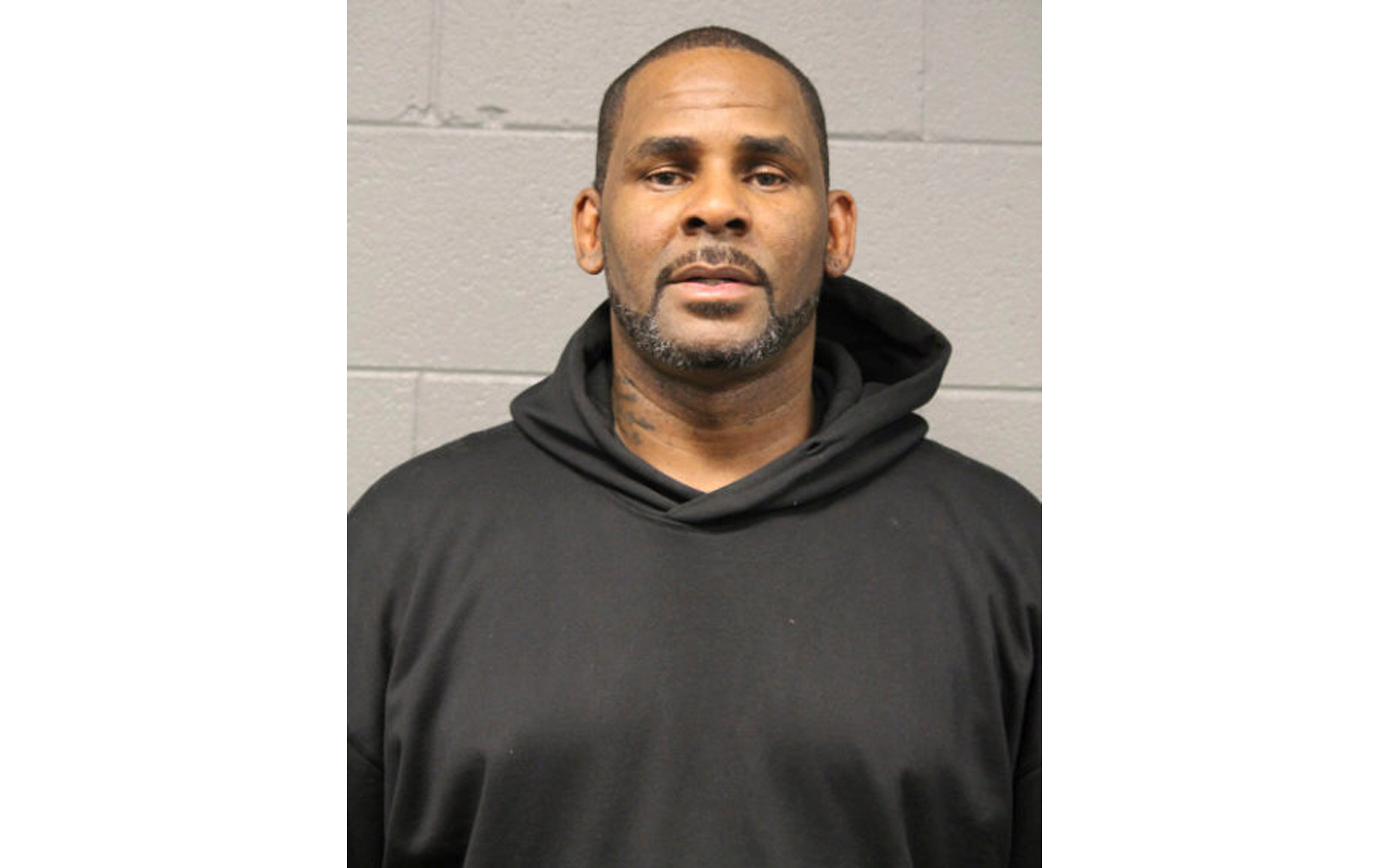 In this photo taken and released by the Chicago Police Dept., Friday, Feb. 22, 2019, singer R. Kelly is photographed during booking at a police station in Chicago, Il. R. Kelly, the R&B star who has been trailed for decades by allegations that he violated underage girls and women and held some as virtual slaves, is being charged with aggravated sexual abuse involving four victims, including at least three between the ages of 13 and 17. (AP)
