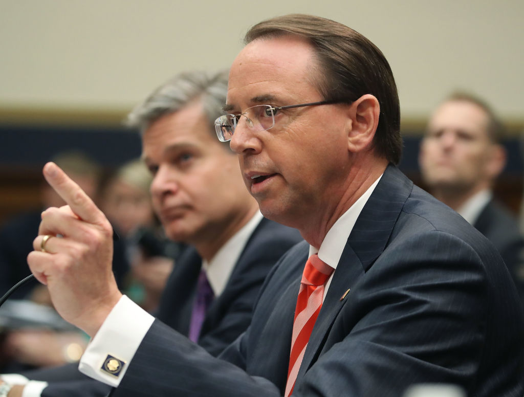 U.S. Deputy Attorney General Rod Rosenstein (R) and FBI Director Christopher Wray (L) testify during a House Judiciary Committee hearing June 28, 2018 on Capitol Hill in Washington, DC. The committee held a hearing on oversight of FBI and DOJ actions surrounding the 2016 election. (Mark Wilson—Getty Images)