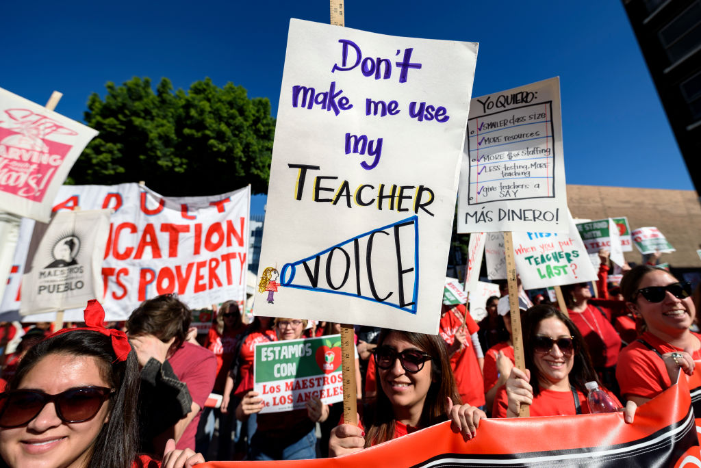 Teachers and supporters of public education march against education funding cuts during the March for Public Education in Los Angeles
