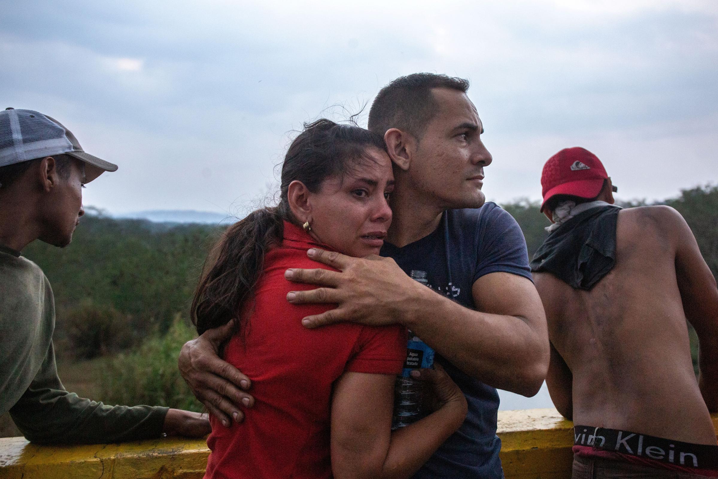 Opposition demonstrators on a bridge that connects Colombia and Venezuela, near the town of Ureña, on Feb. 23