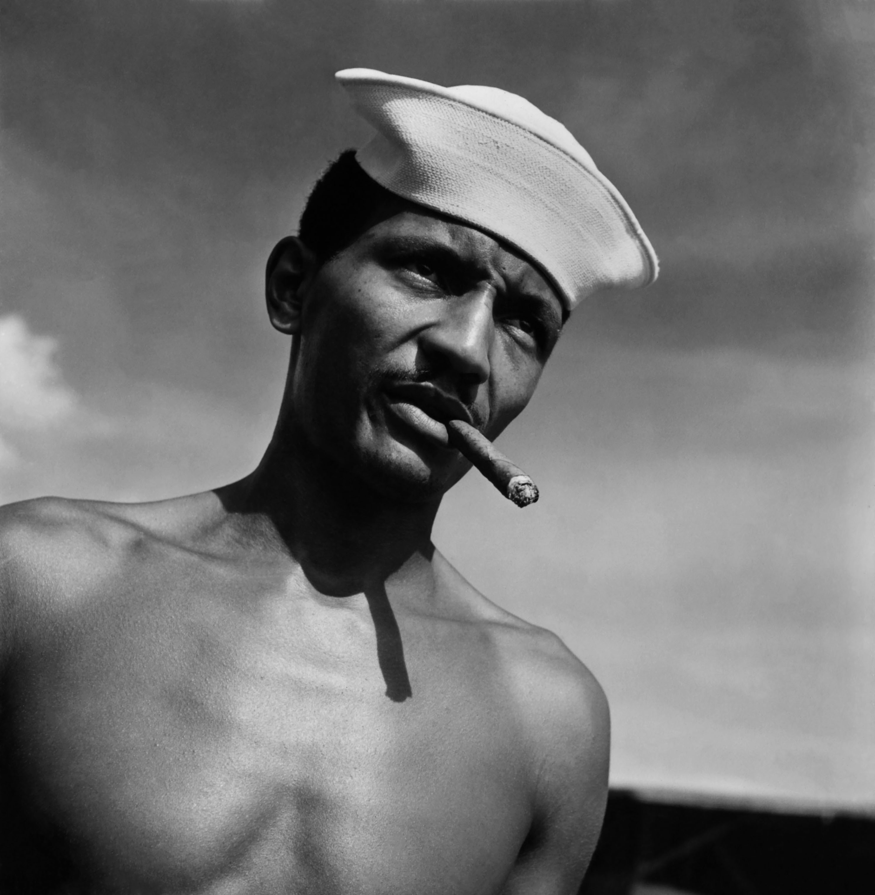 A soldier assigned to work as a laborer at the U.S. Naval Supply Depot on Guam, in 1945. (Wayne Miller—Magnum Photos)