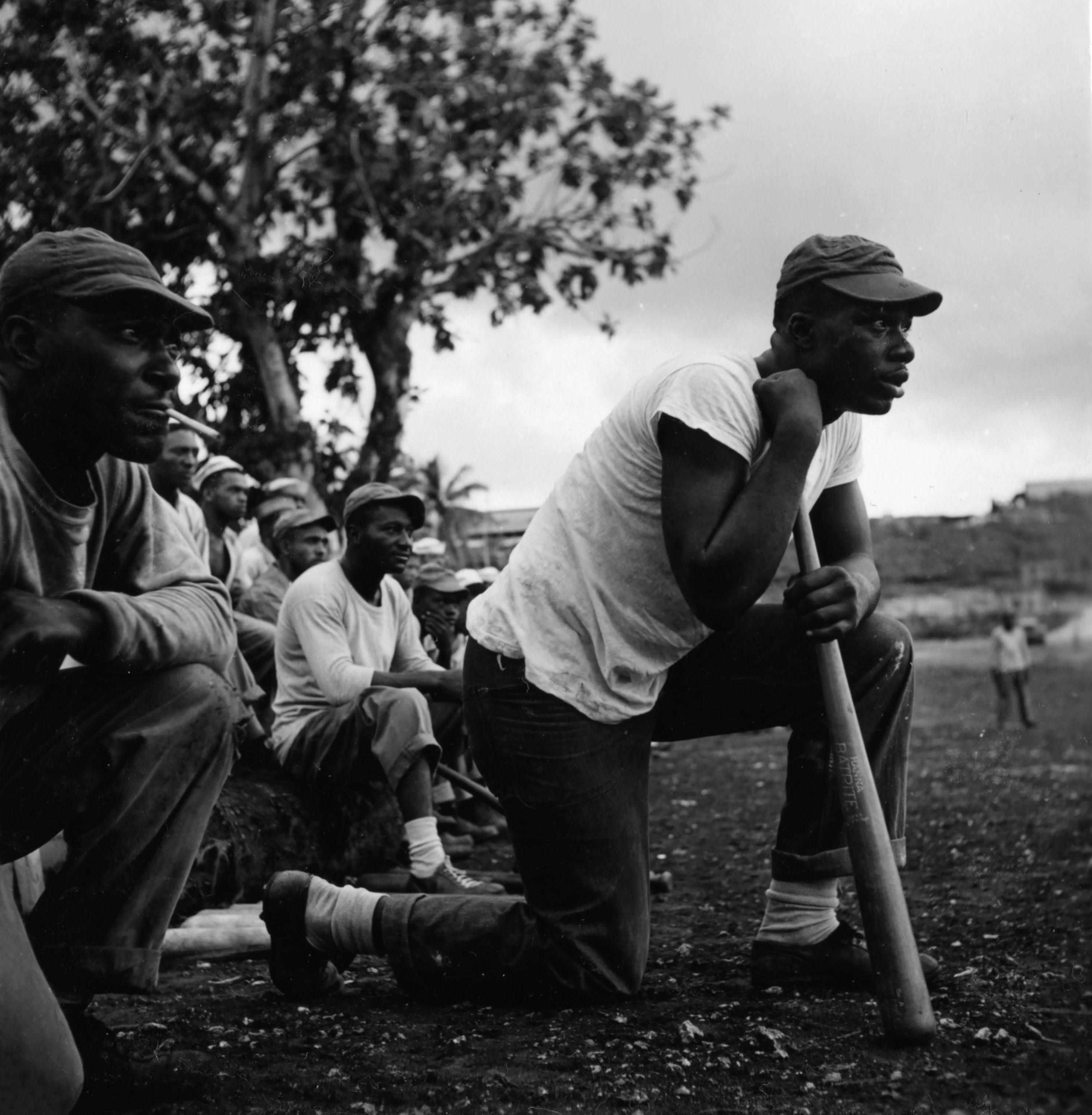 Sailors assigned to work as laborers at the U.S. Naval Supply Depot on Guam playing baseball. (Wayne Miller—Magnum Photos)